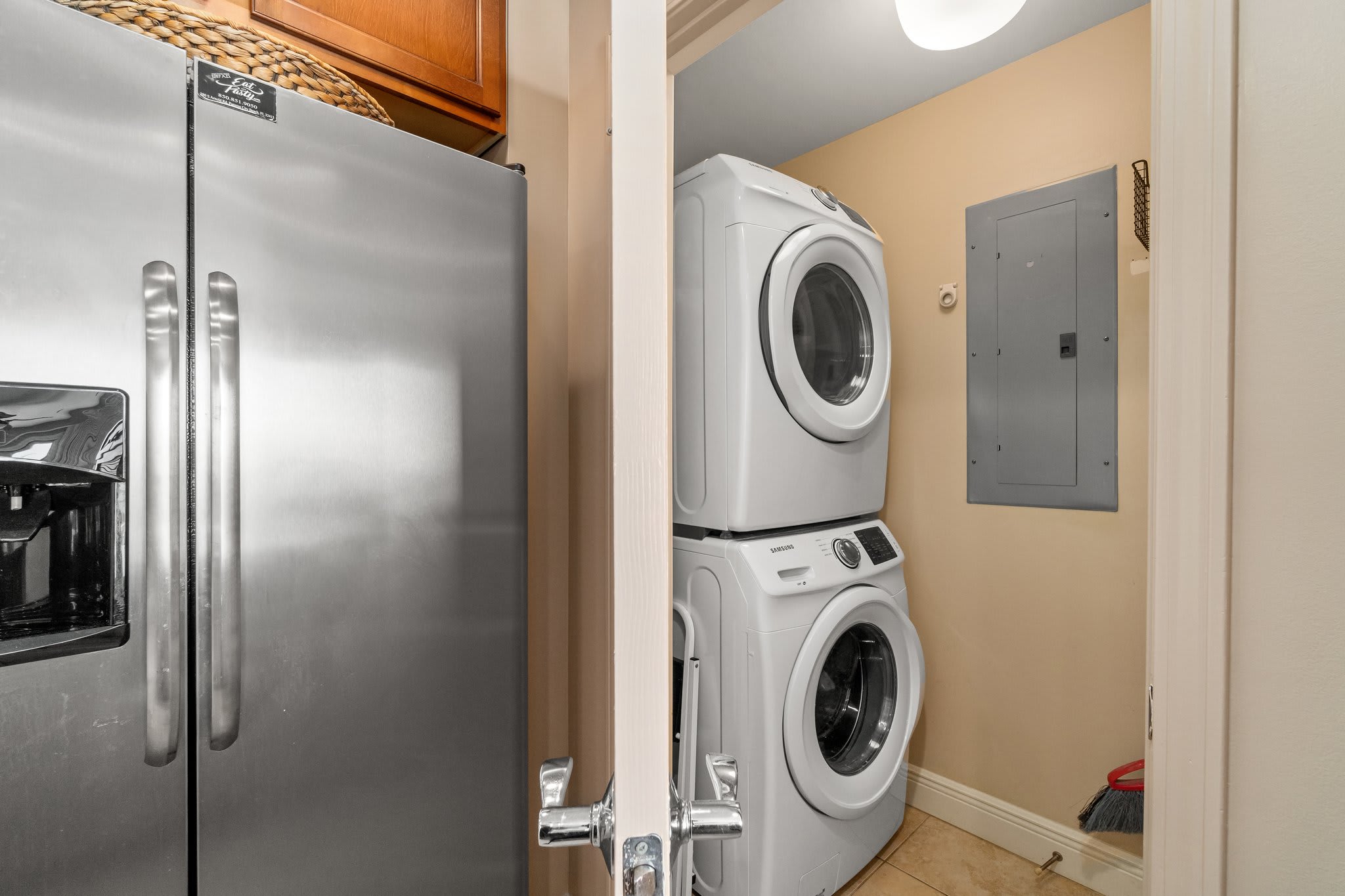 Fridge leading to the washer and dryer.