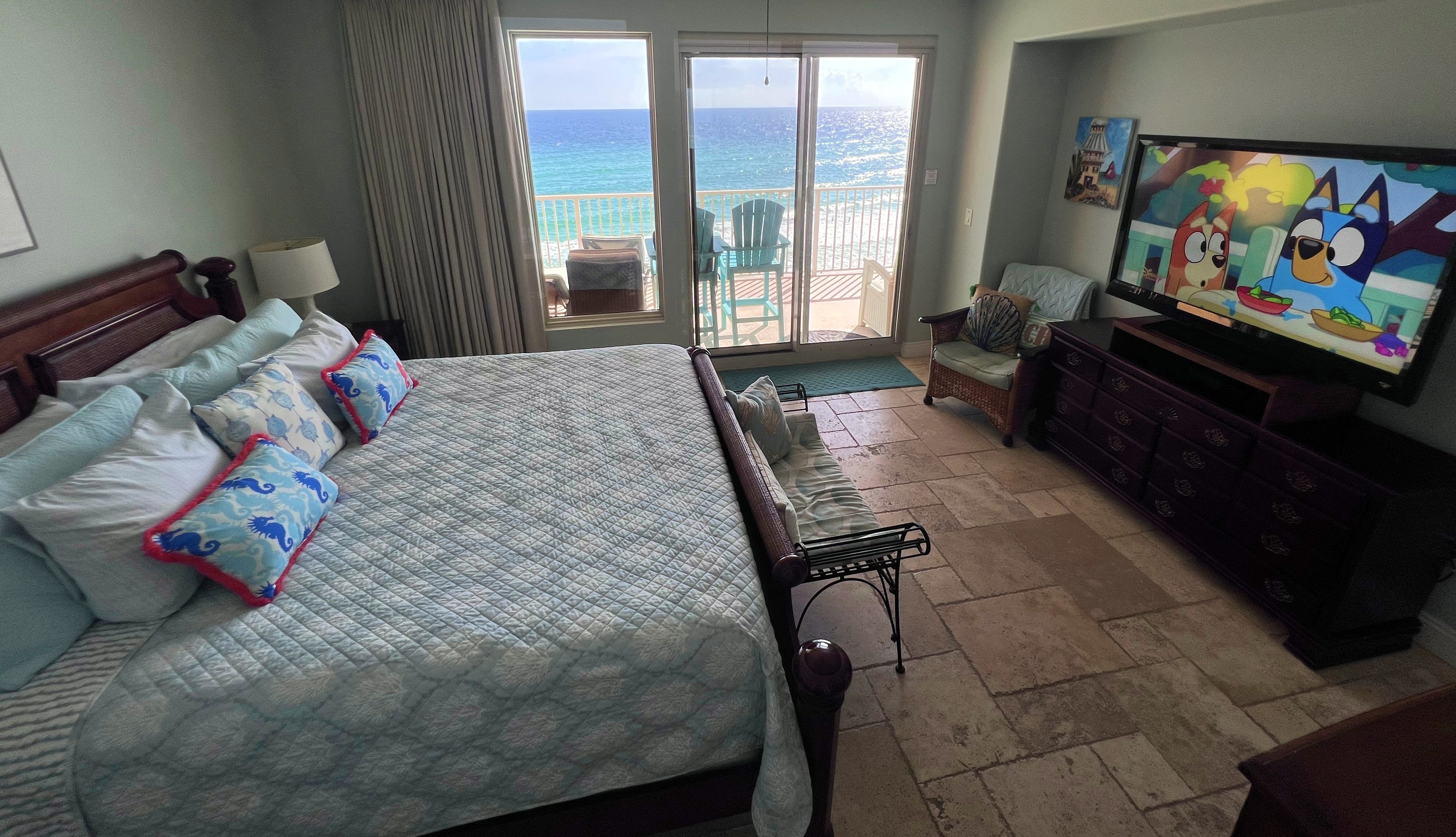 Master bedroom suite with 55" Flat screen TV, DVD player with balcony access with view of Gulf