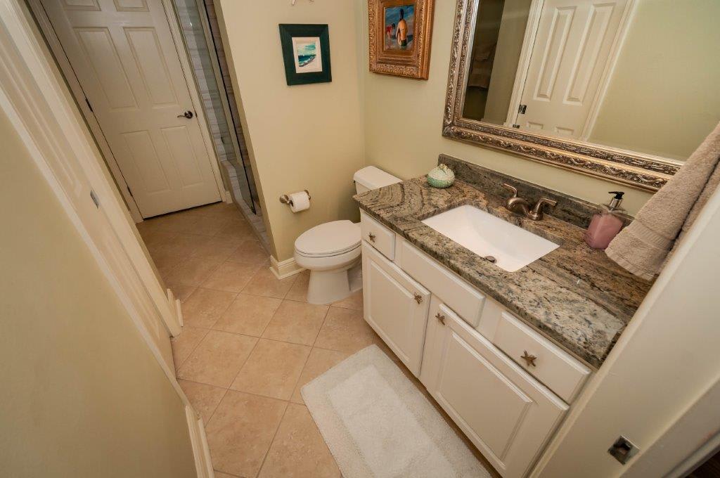 master bath with new granite counter tops and ADA toilet