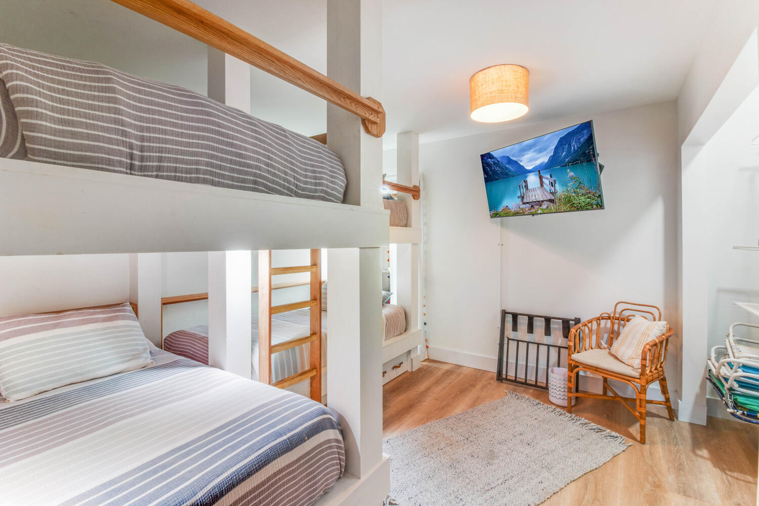 Bunk room has a spacious closet with beach chairs, games, and books.