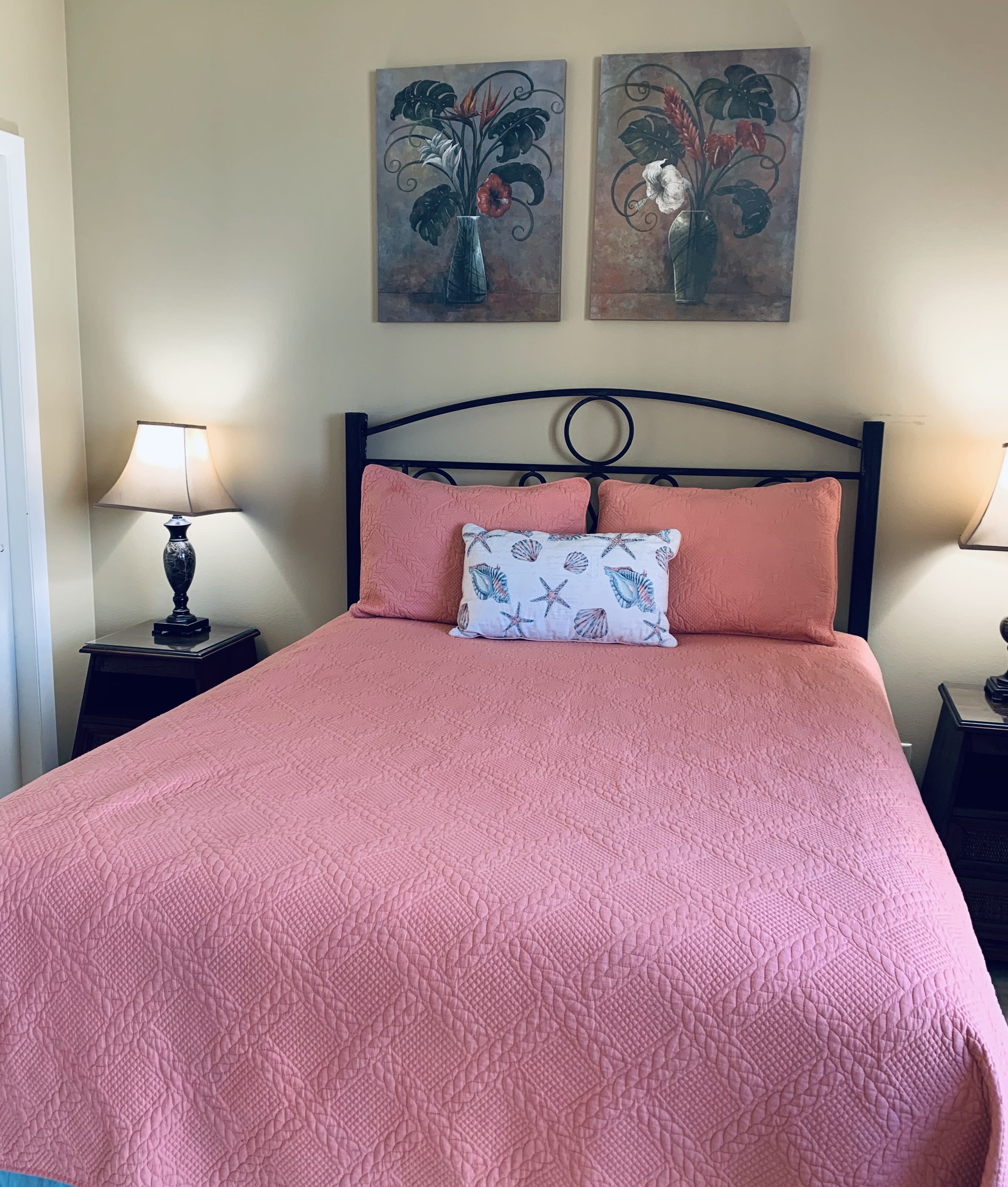 2nd bedroom features a queen bed and balcony access.