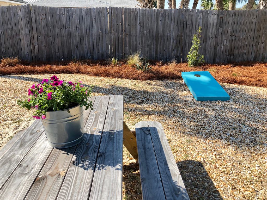 Picnic and Corn Hole Game, backyard is nicely landscaped. Great Play Area!