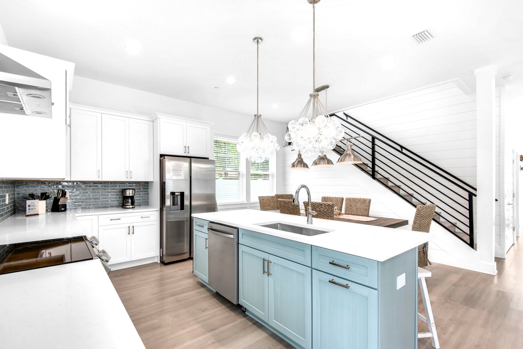 Azure-14 Create your culinary masterpieces in Azure's new kitchen, featuring stainless appliances with quartz counters and subway tile backsplash.