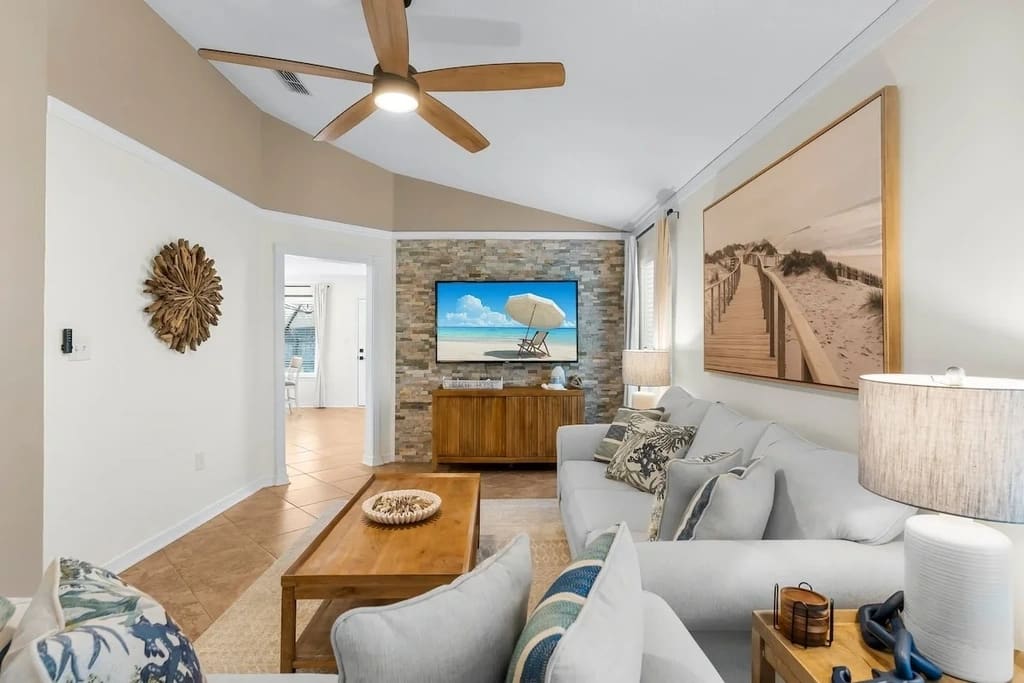 The living room of Serenity At Emerald Escape is a stylish oasis of comfort and relaxation.