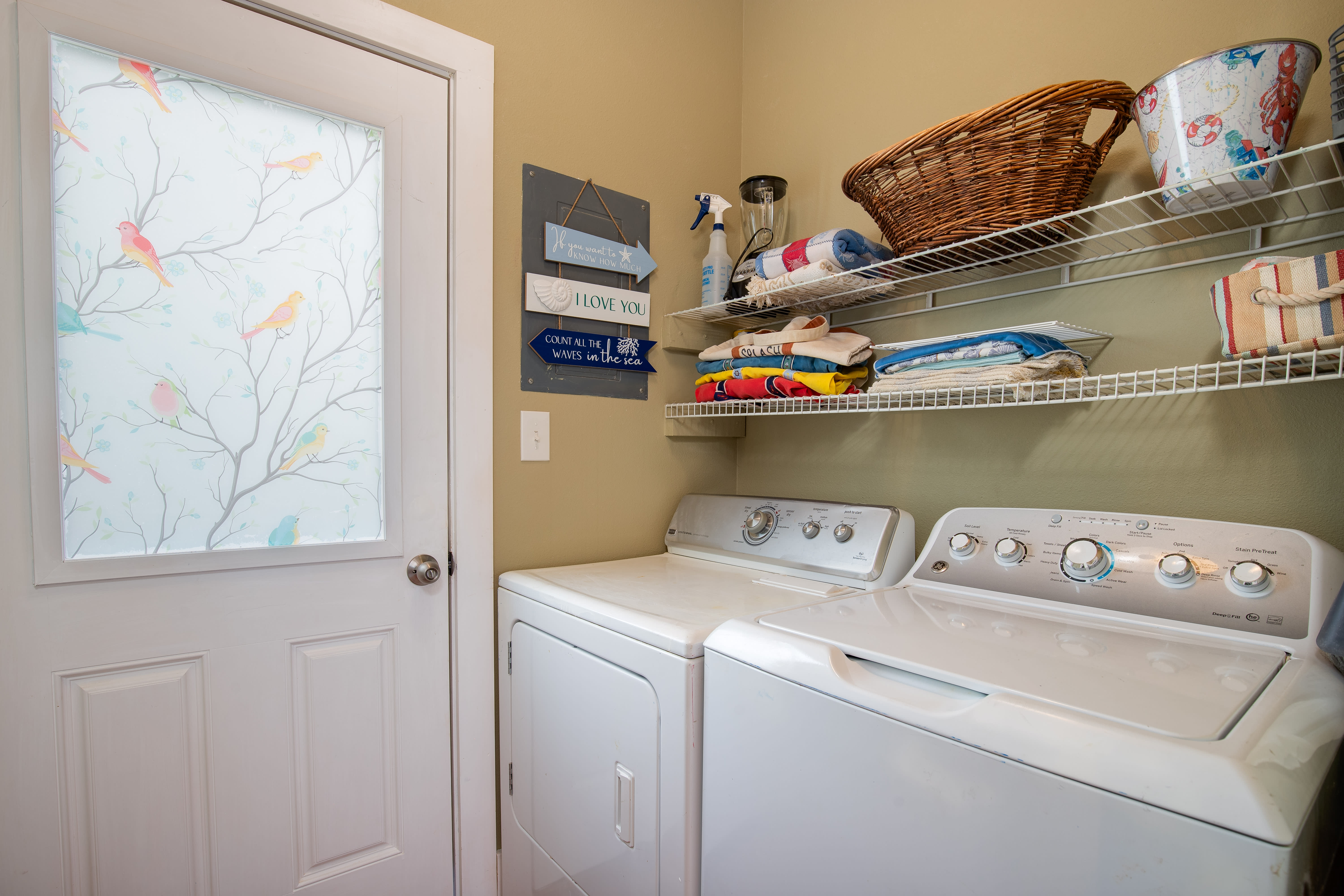 Laundry room located just off the kitchen.