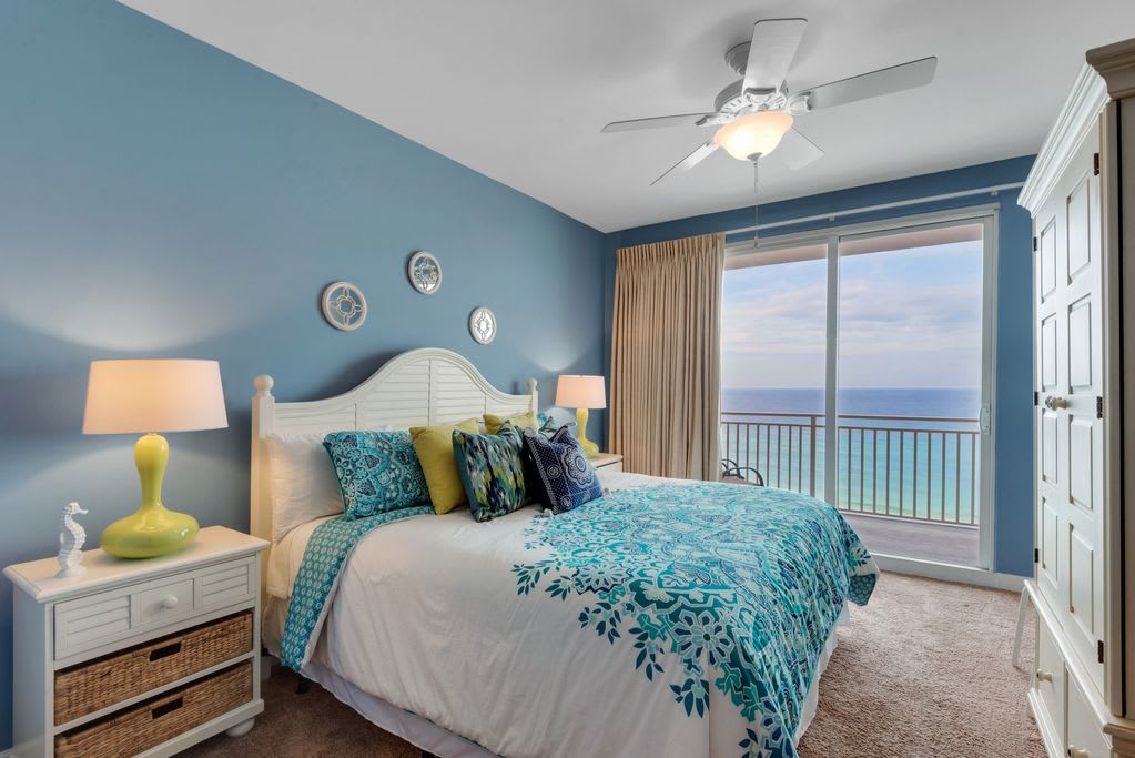 The master bedroom is a cozy escape, with its own balcony access.