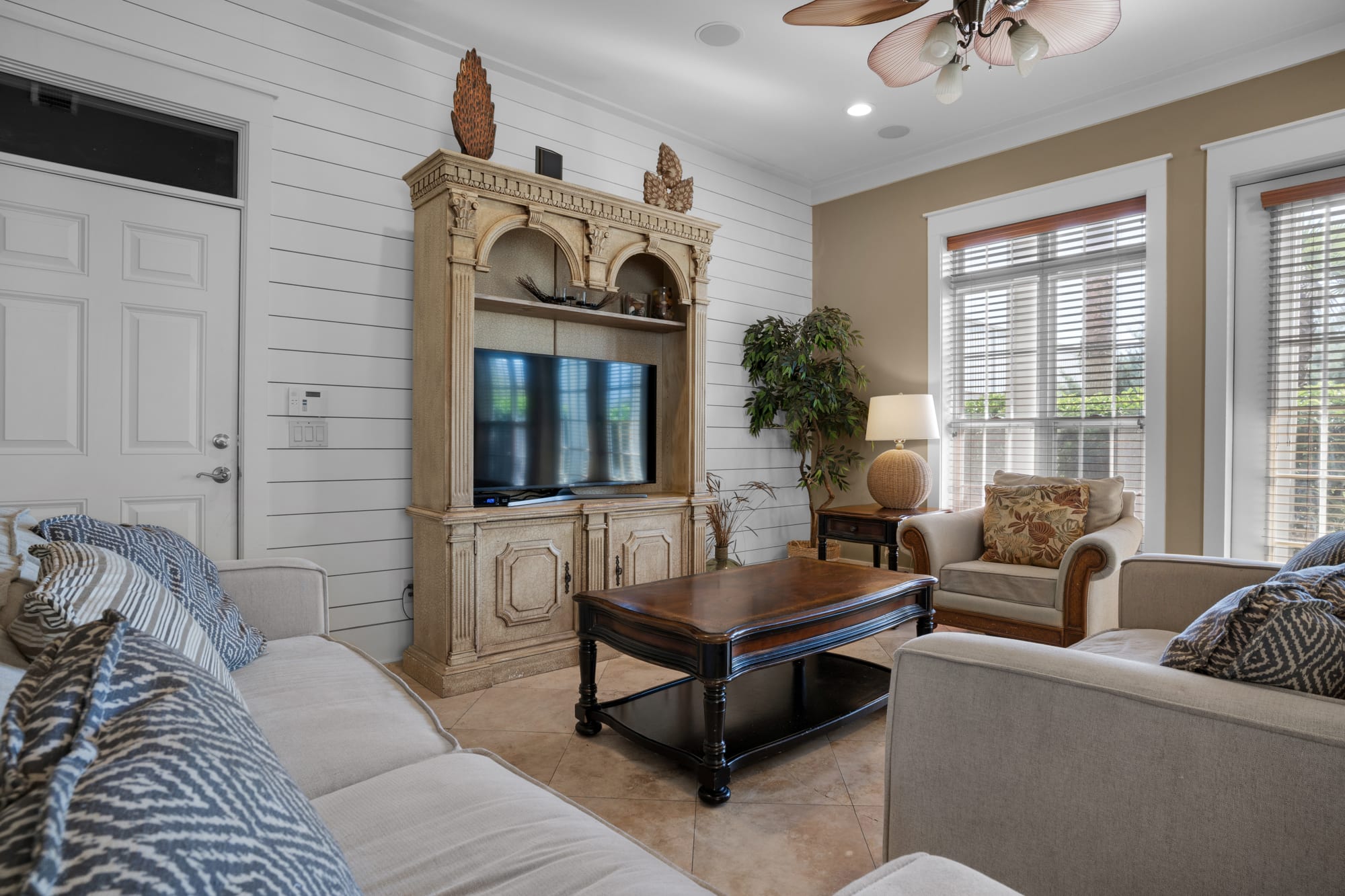 The living room has lots of windows and sunlight!