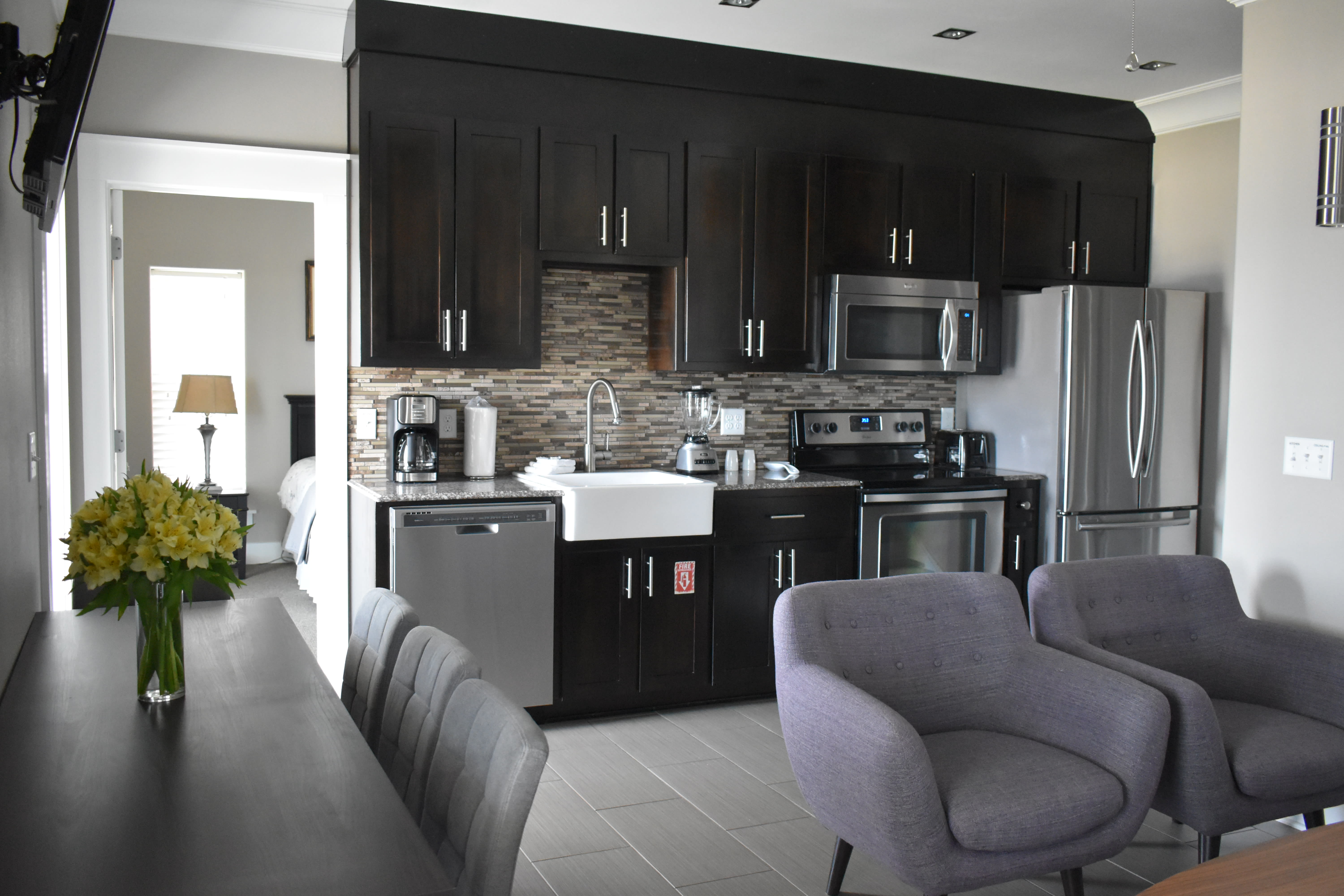 2ND FLOOR LIVING AREA, DINING, &amp; FULL KITCHEN - OPENS TO GULF FRONT BALCONY