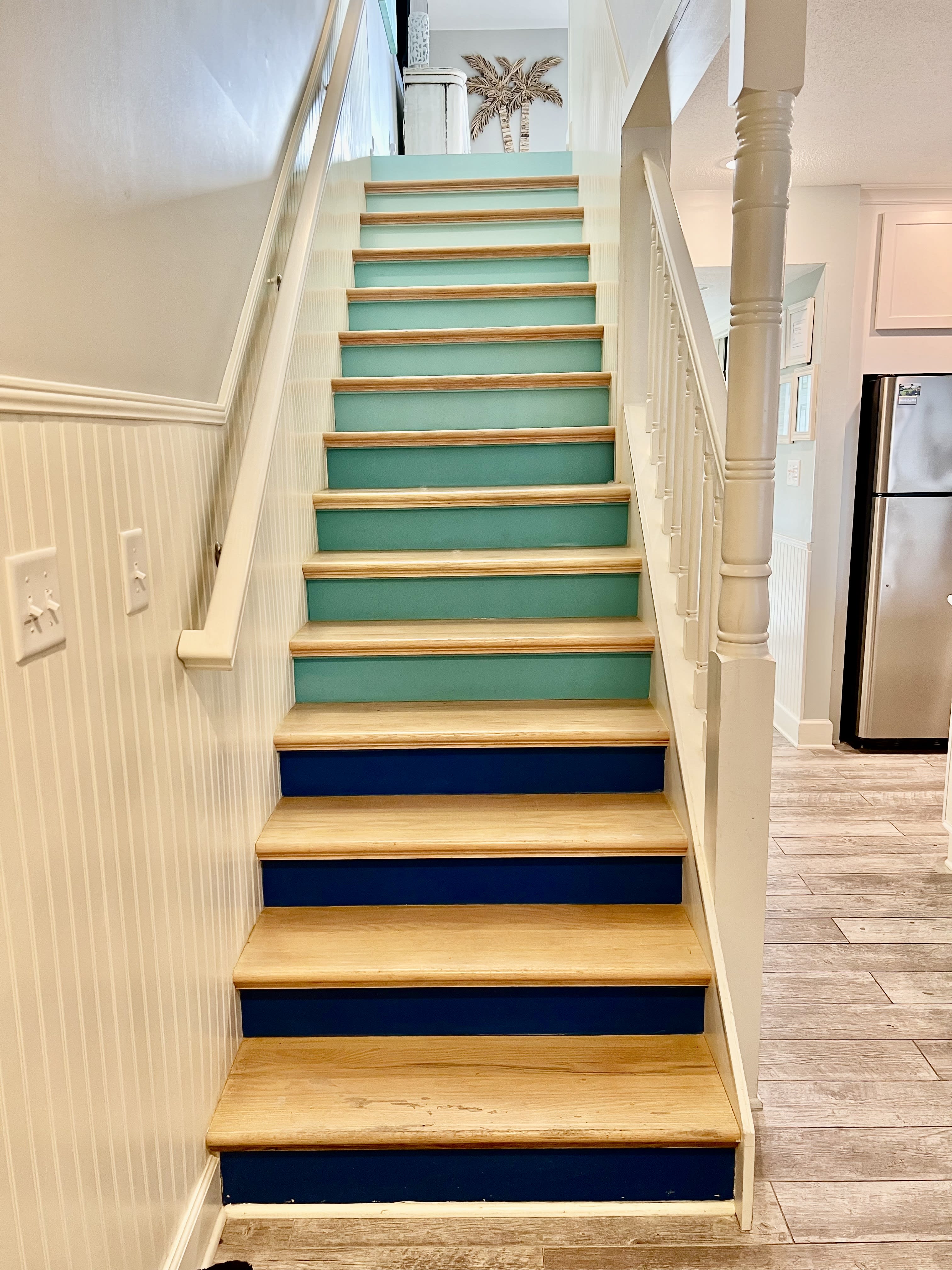 Follow the colorful stairs to the living room and enjoy the stunning gulf view