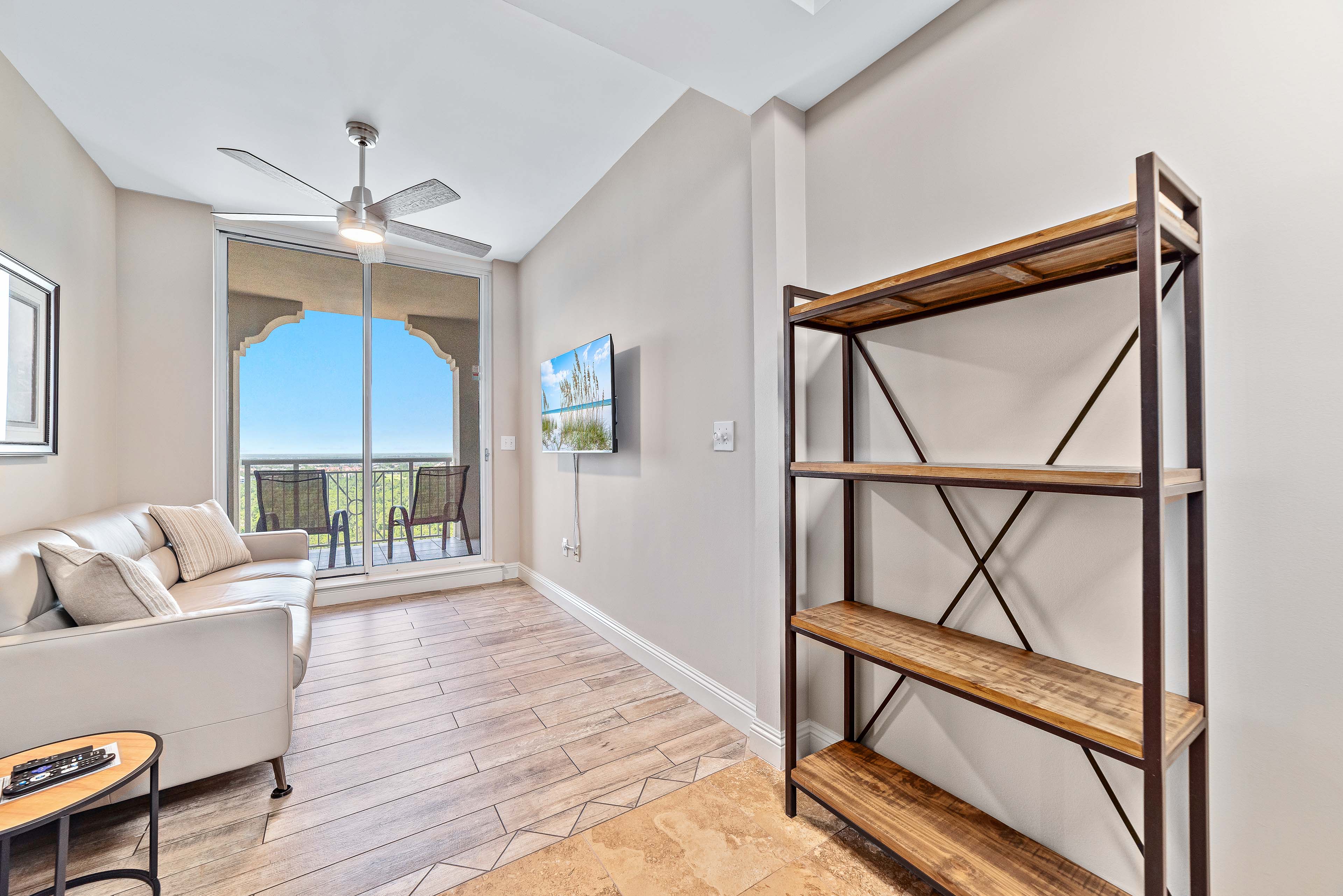 "Bonus Den" with Natuzzi leather sleeper sofa, wall tv,  and "second" balcony