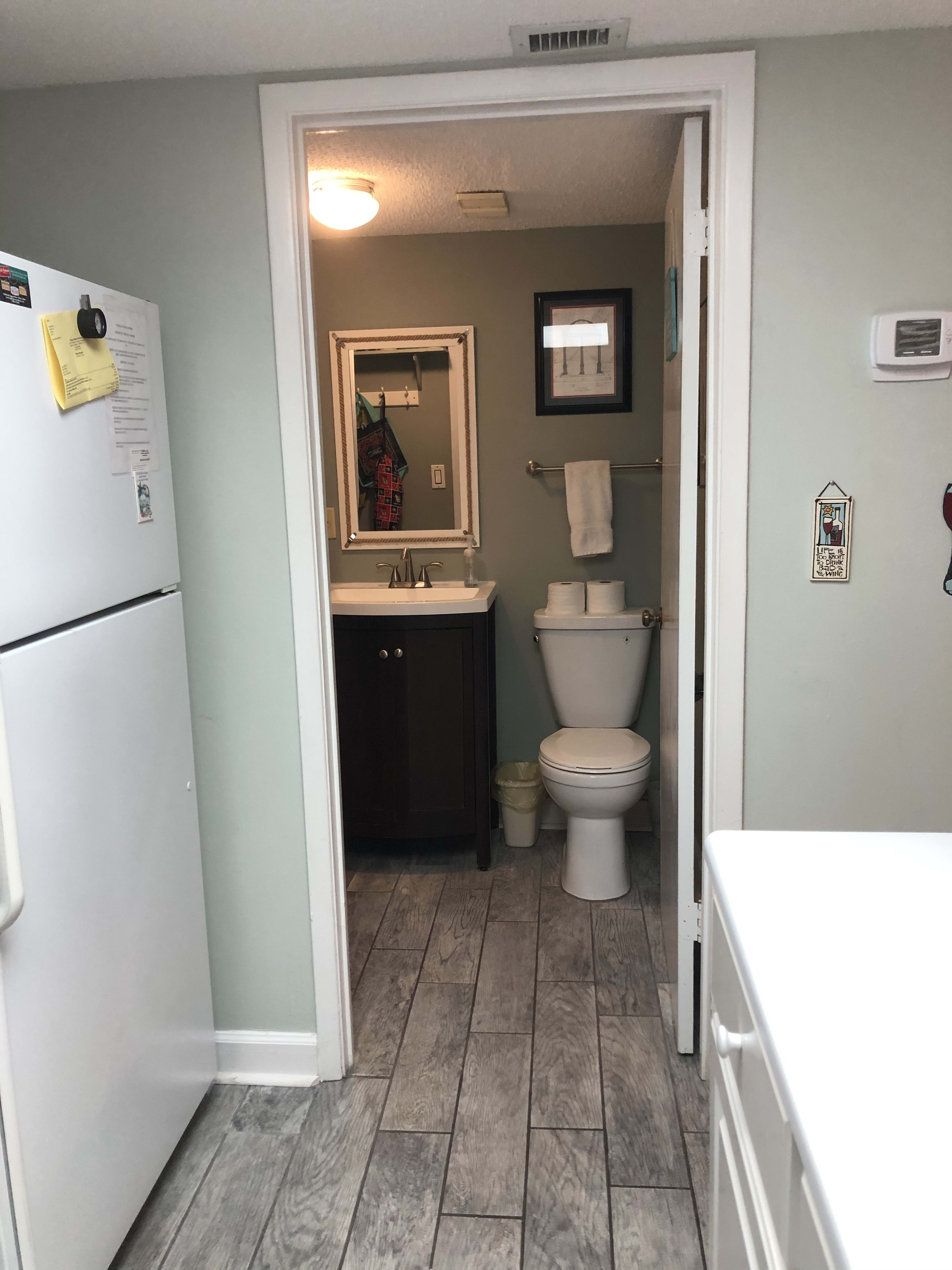 half bath and laundry room located off the kitchen
