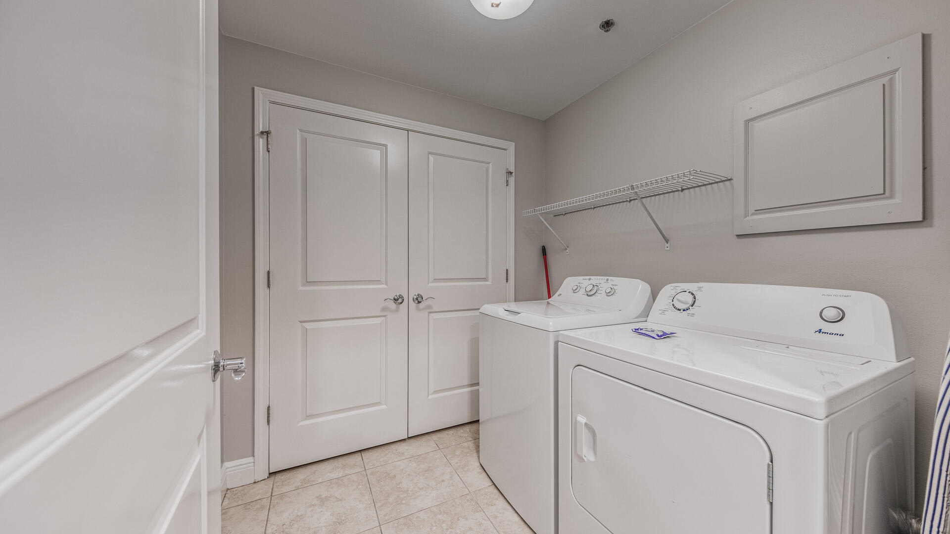 Full size Laundry Area with storage closet