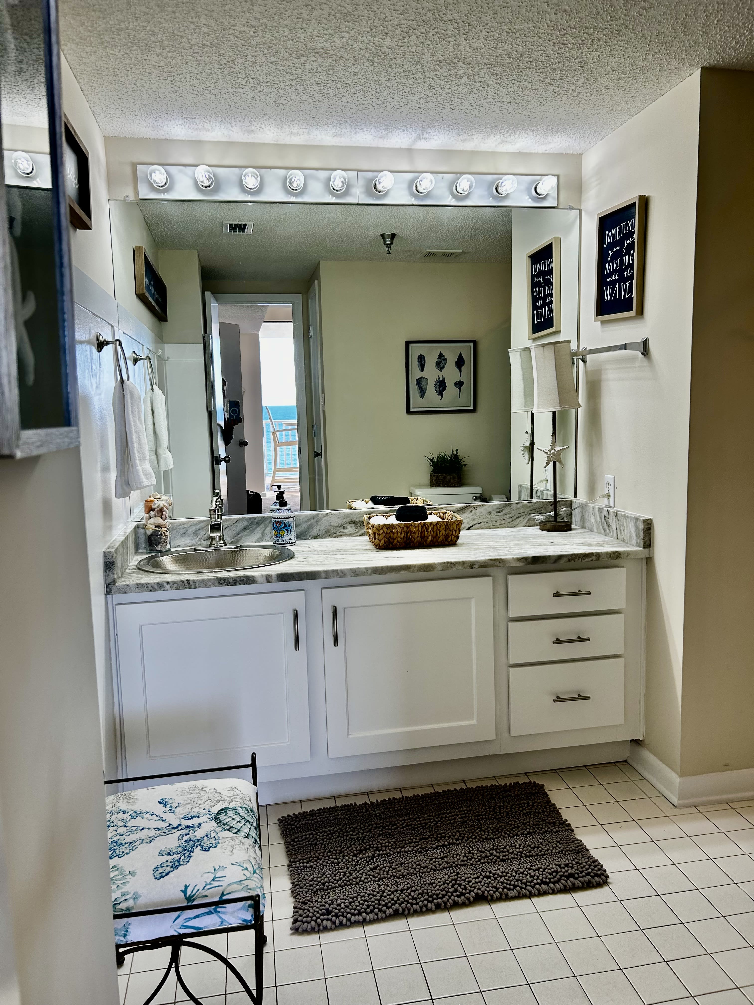 Large Master Bath with newly remodeled cabinets and granite countertop.