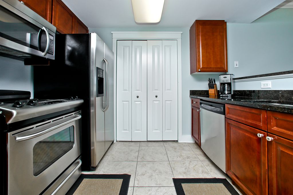 Kitchen with Stainless Steel appliances. new dishwasher not shown W/D past doors