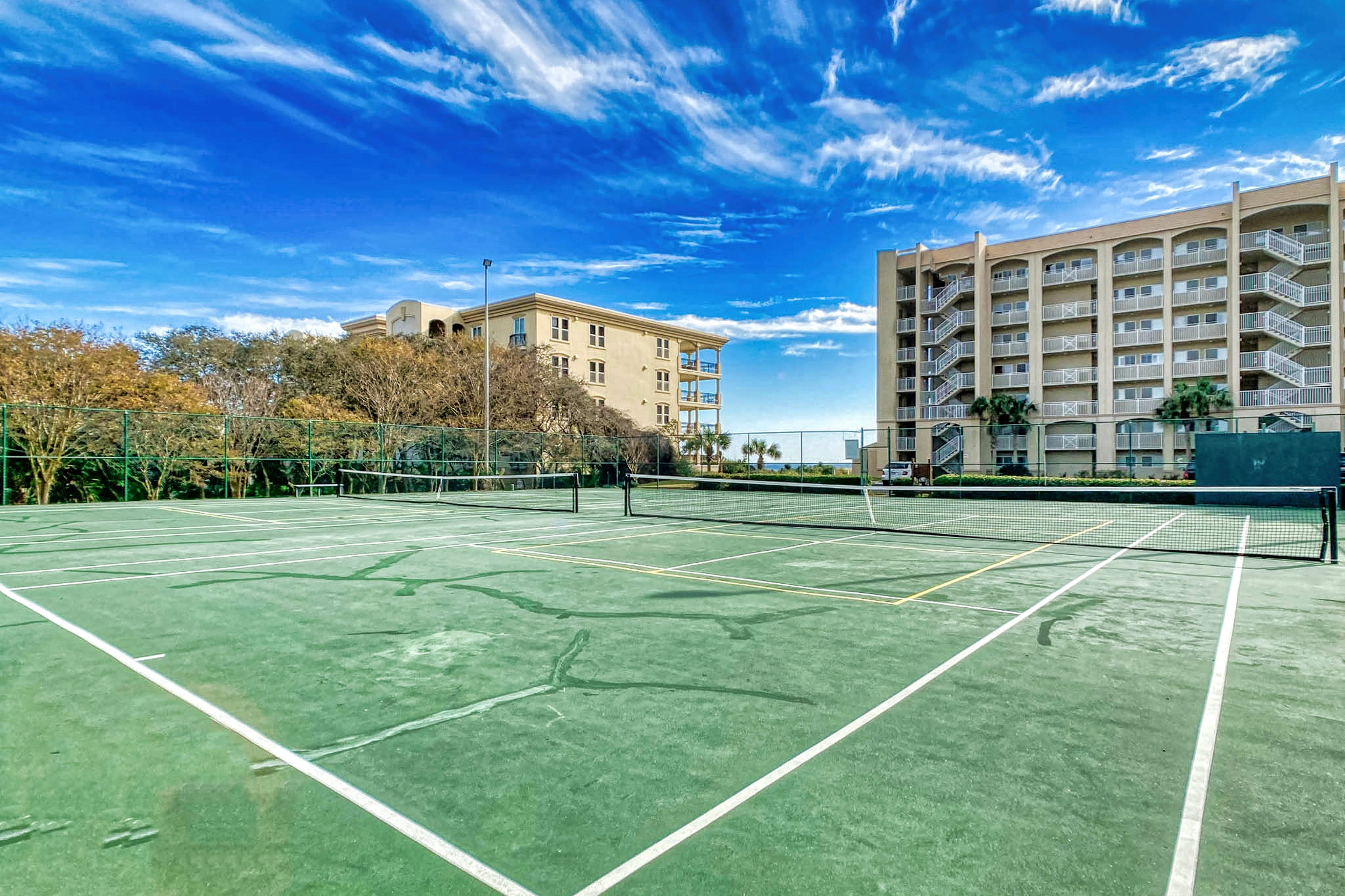 Enjoy a friendly match on our lighted tennis courts with a beachside breeze!