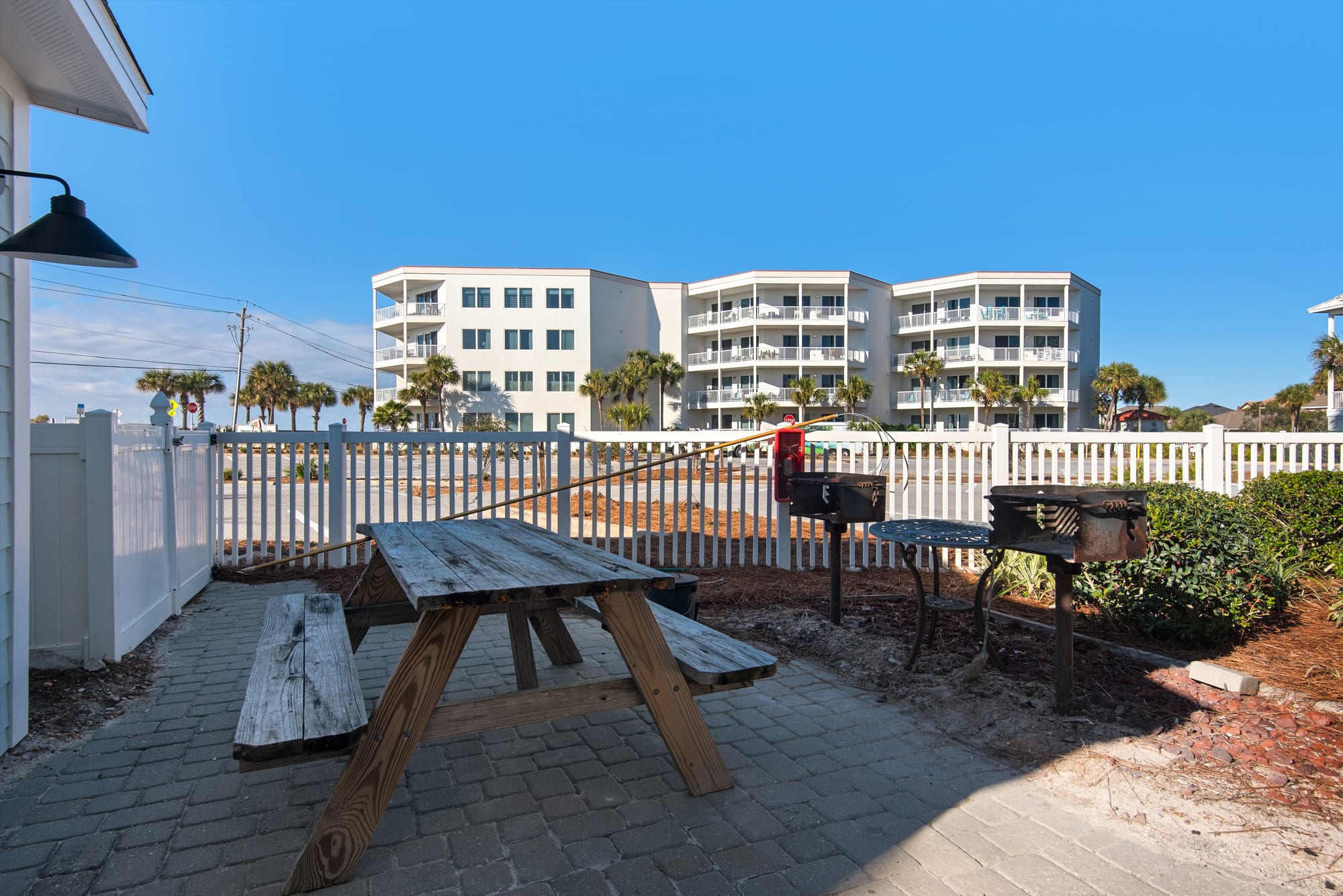 Communal charcoal grilling with picnic table 