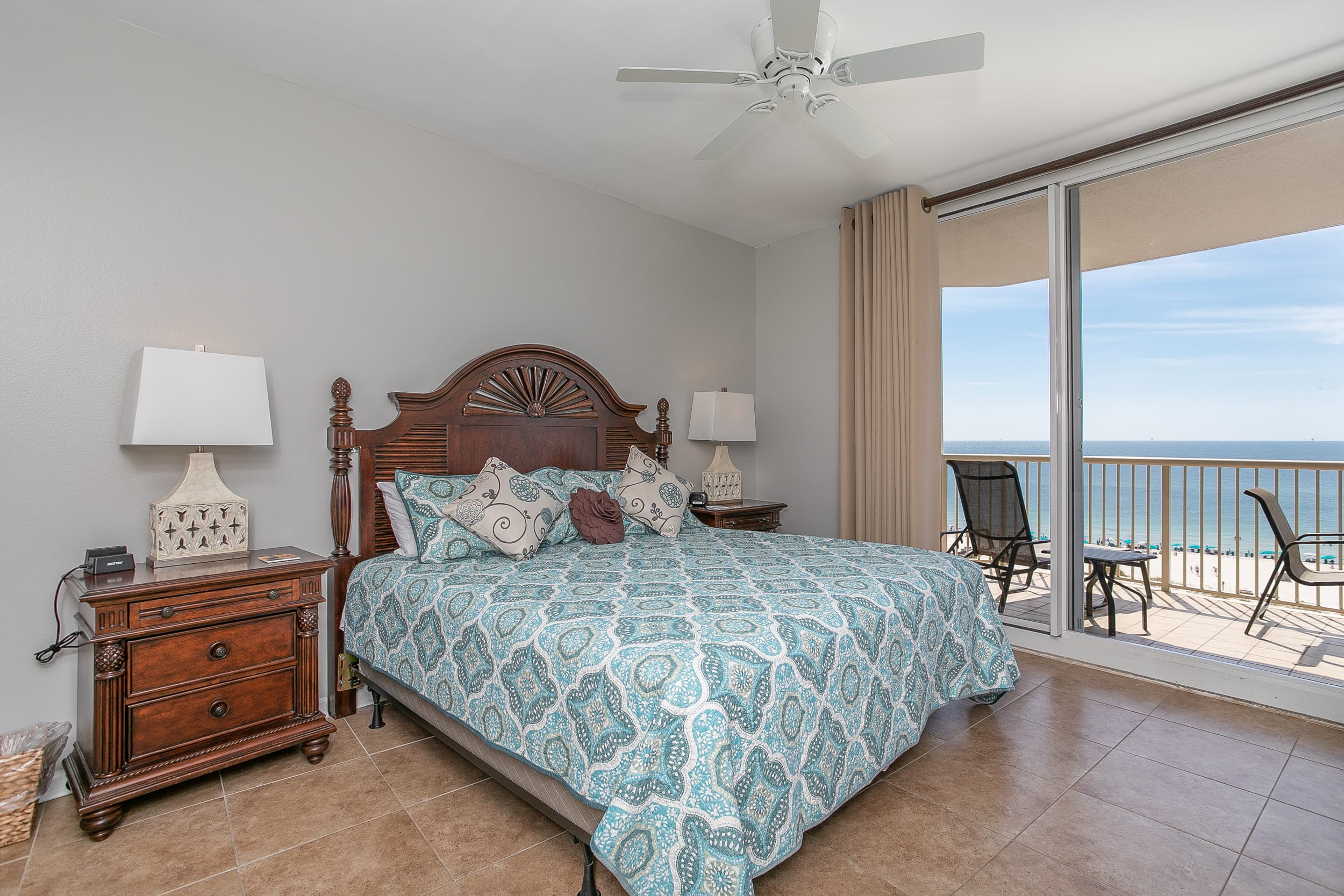 Master Bedroom w/Kind Bed and Balcony Access