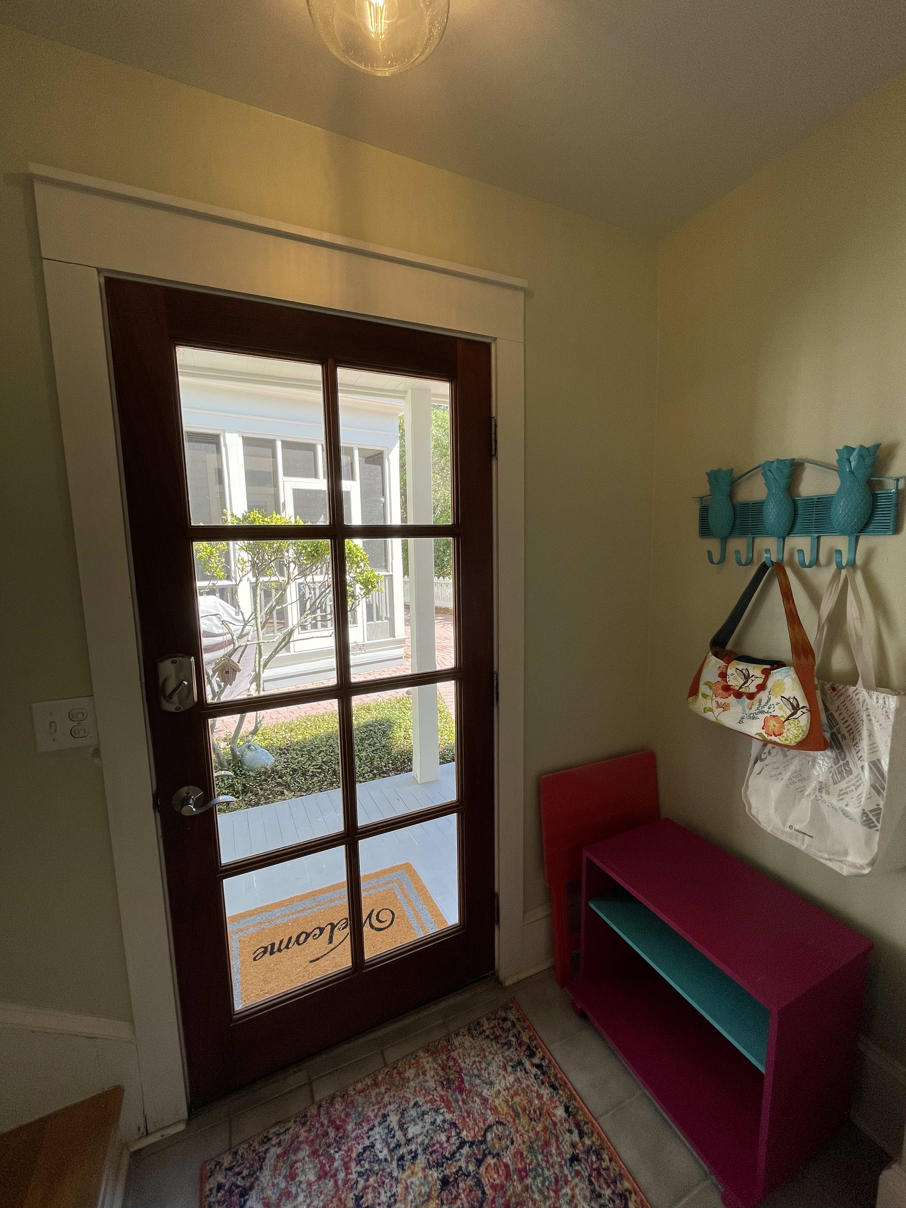 Entry foyer w/ full size washer &amp; dryer and storage