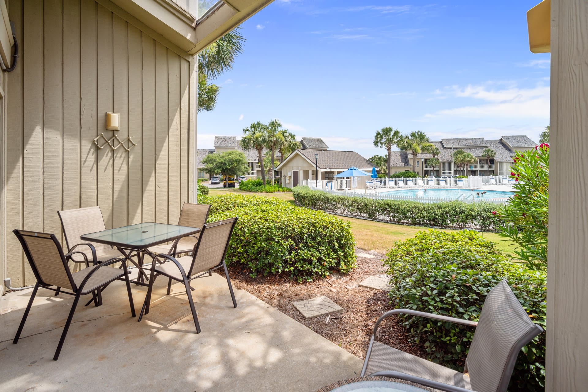 Patio has view of pool and gulf