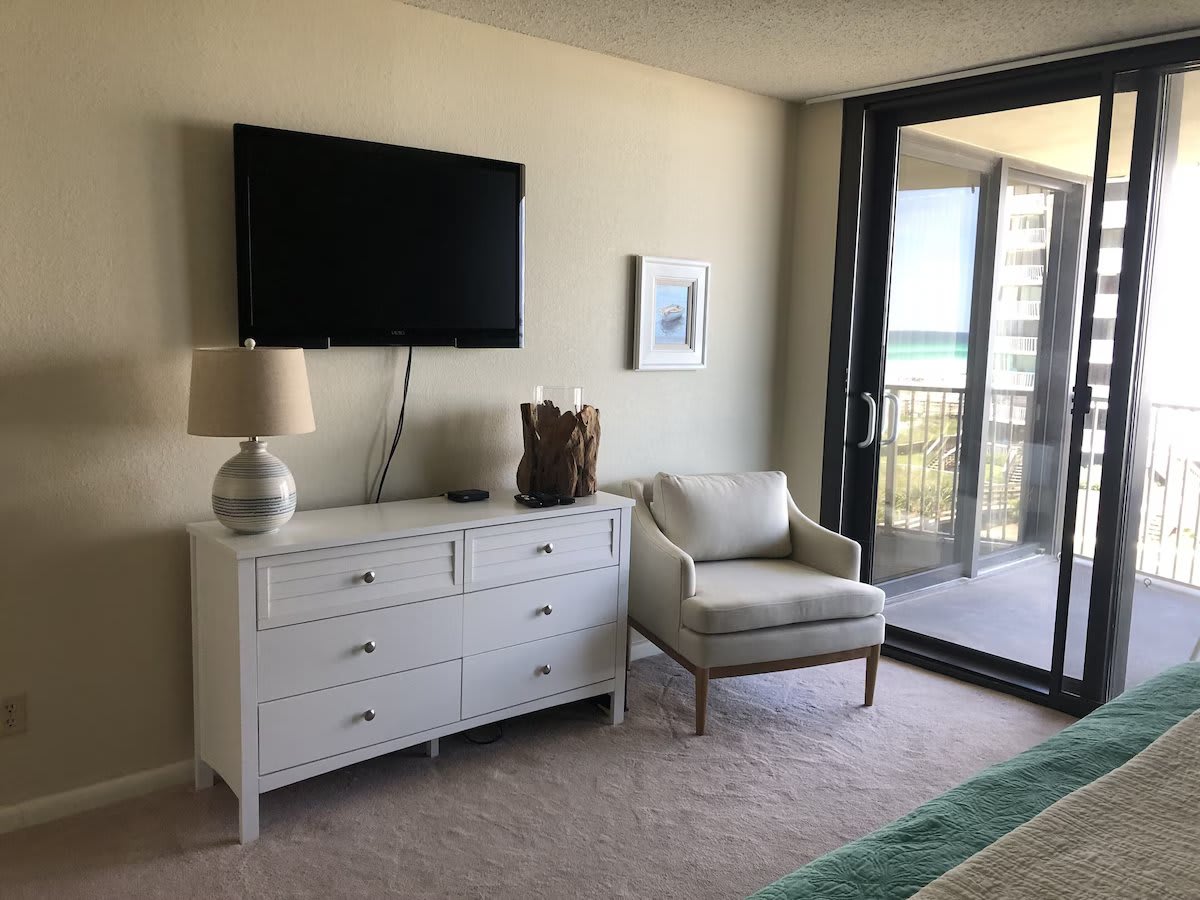 Master bedroom. 46&rdquo; Flatscreen TV. Patio doors to balcony.