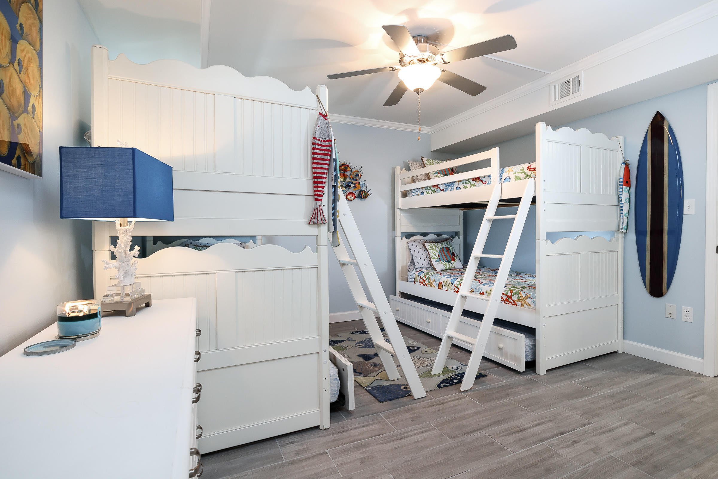 The bunk bedroom has four bunk beds and two trundles. 