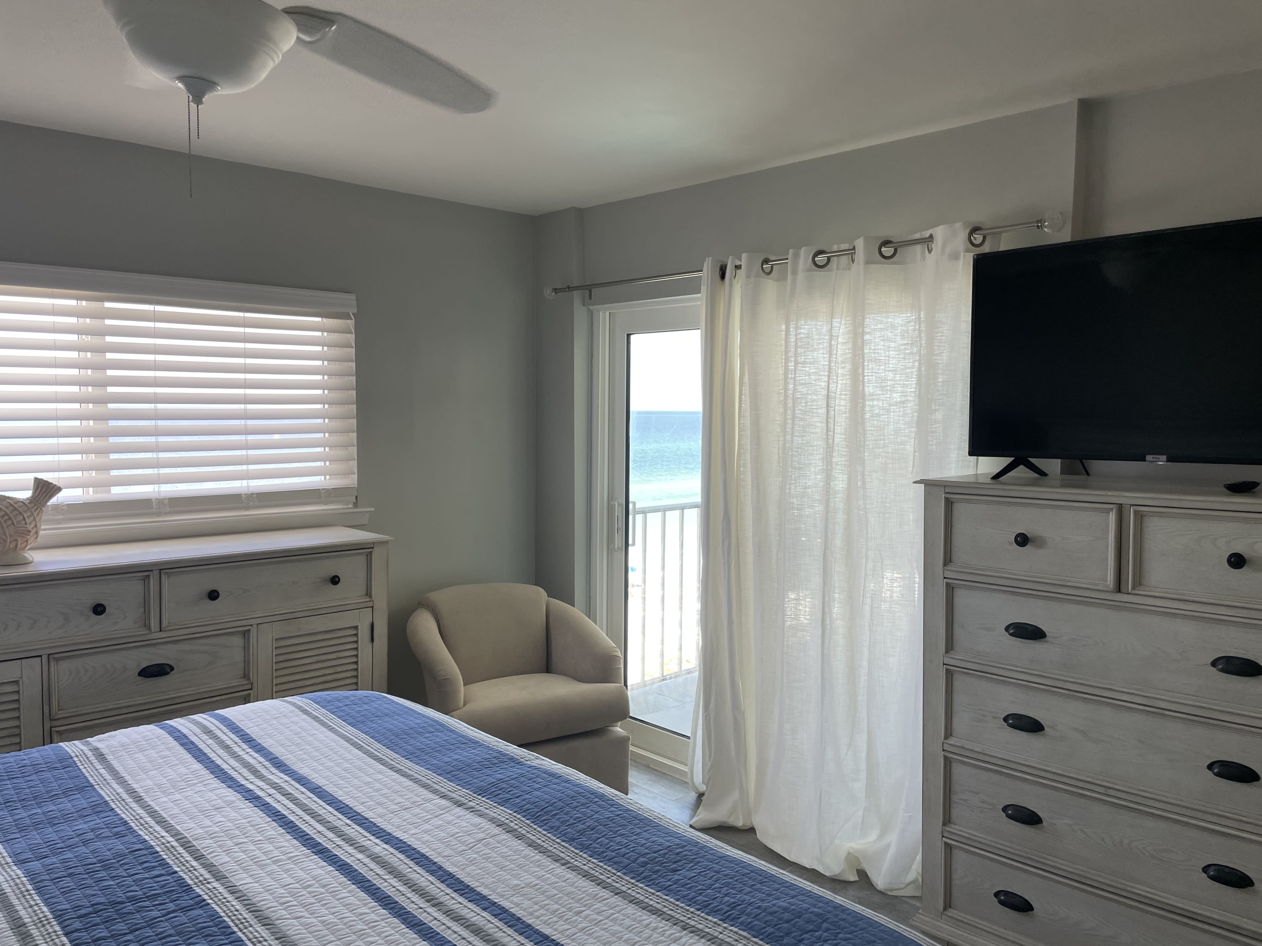 Master Bedroom with Access to Balcony and Flat Screen TV