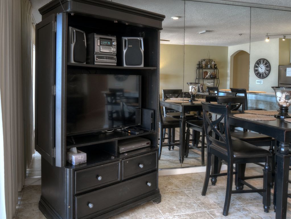 View of amoire with TV and other equipment