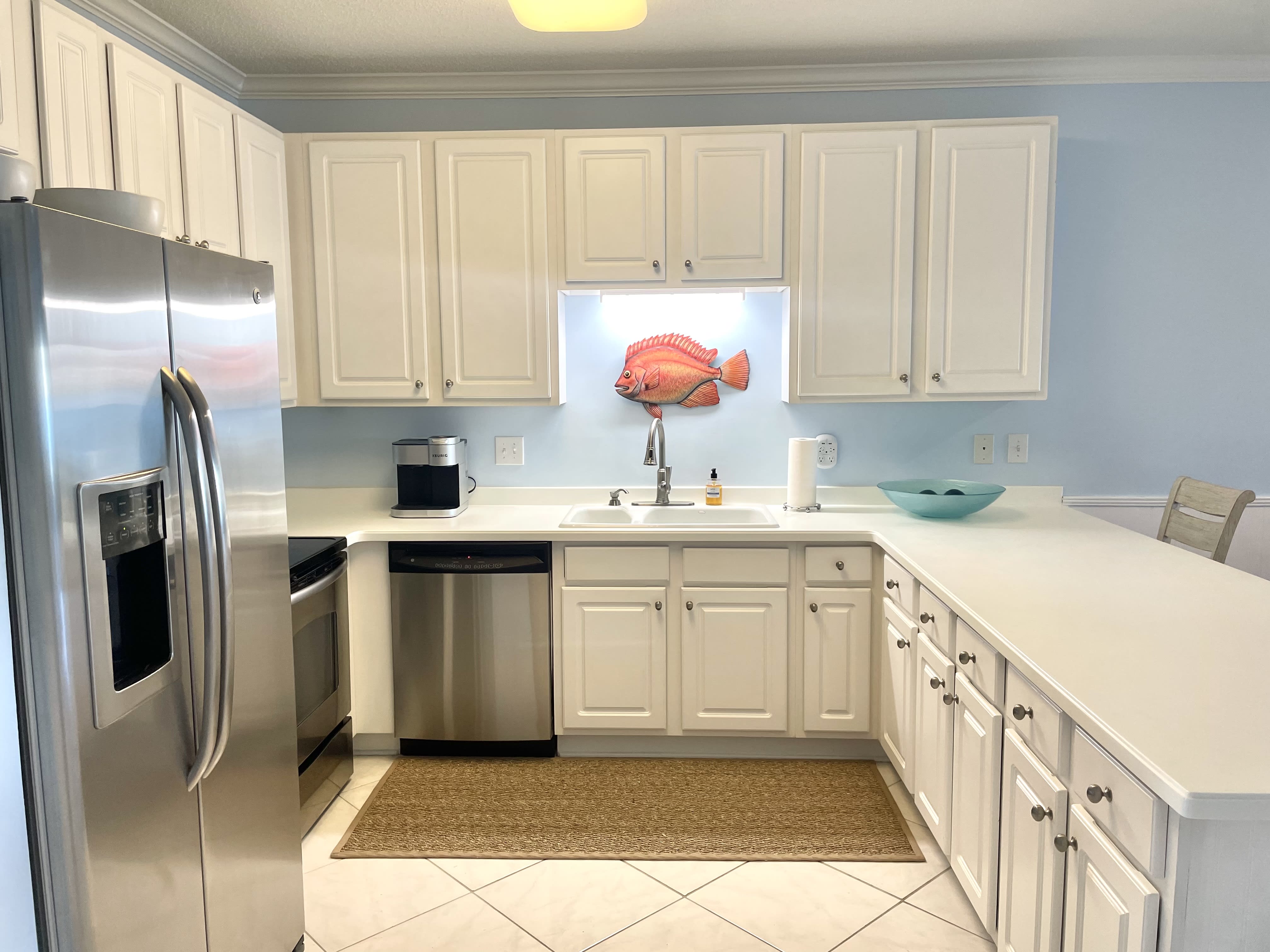 KITCHEN IS WELL STOCKED AND SPACIOUS FOR PREPARING YOUR FAVORITE MEALS 