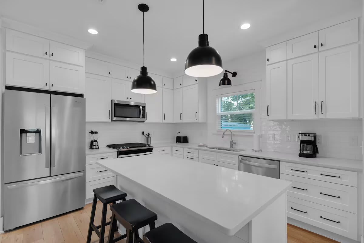 Clean white gourmet kitchen.