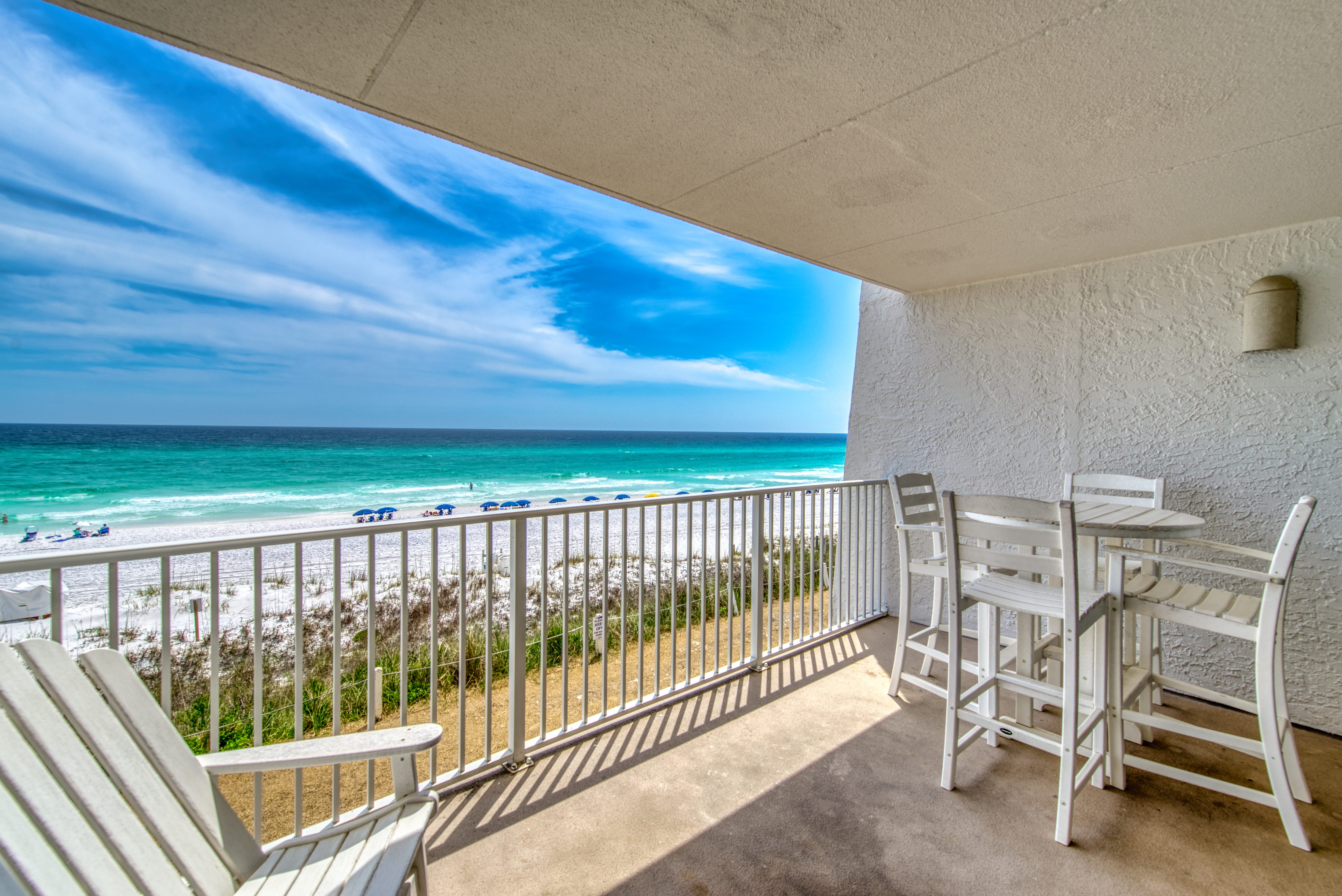 Relax on your private balcony with breathtaking beach views!