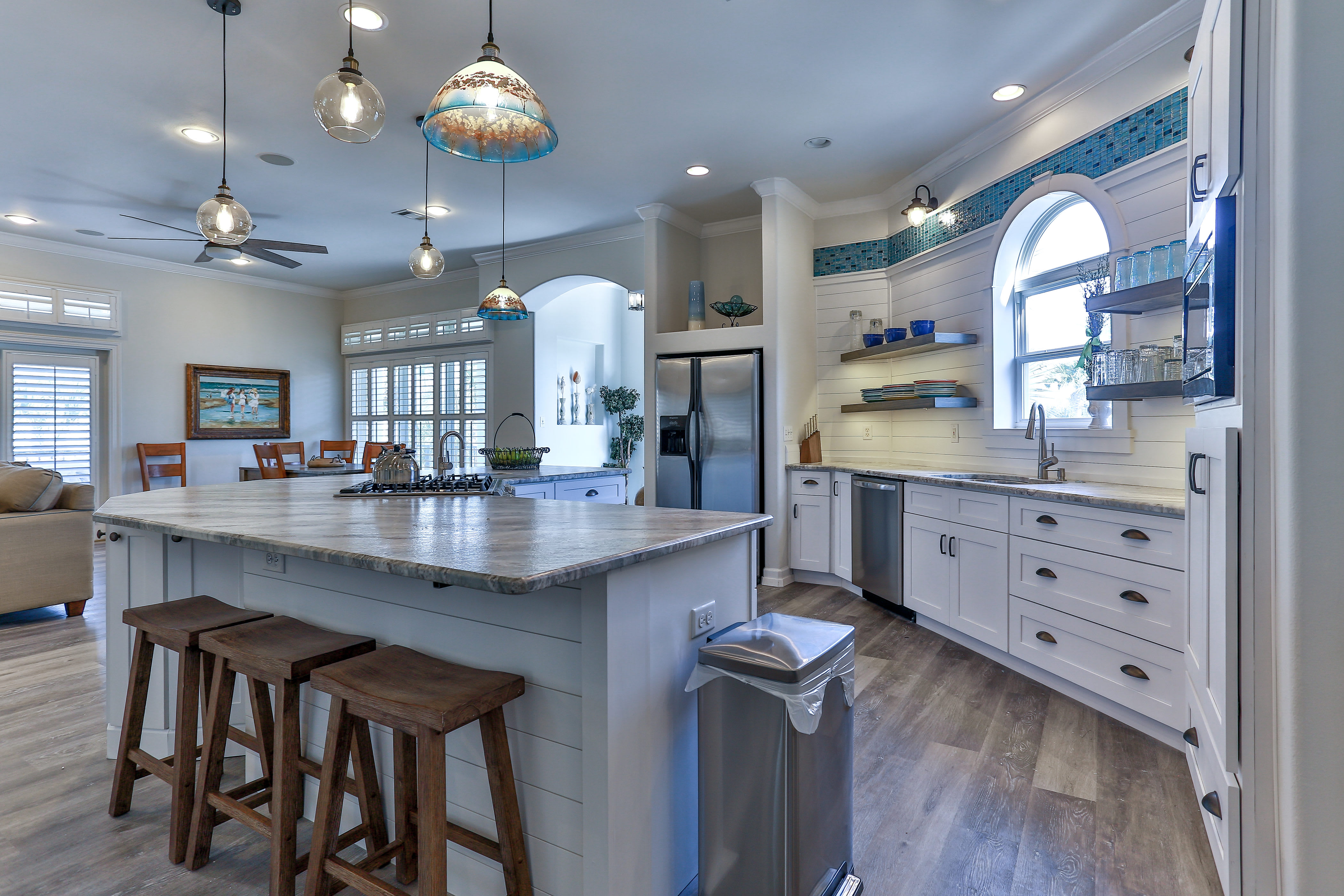 Kitchen features rare gas range with griddle burner and handy prep sink