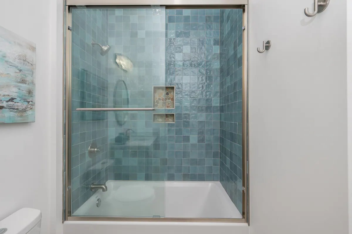 Iris-23 Bedroom 1 Bath. Pic 2. King with attached bath with shower/tub combo.