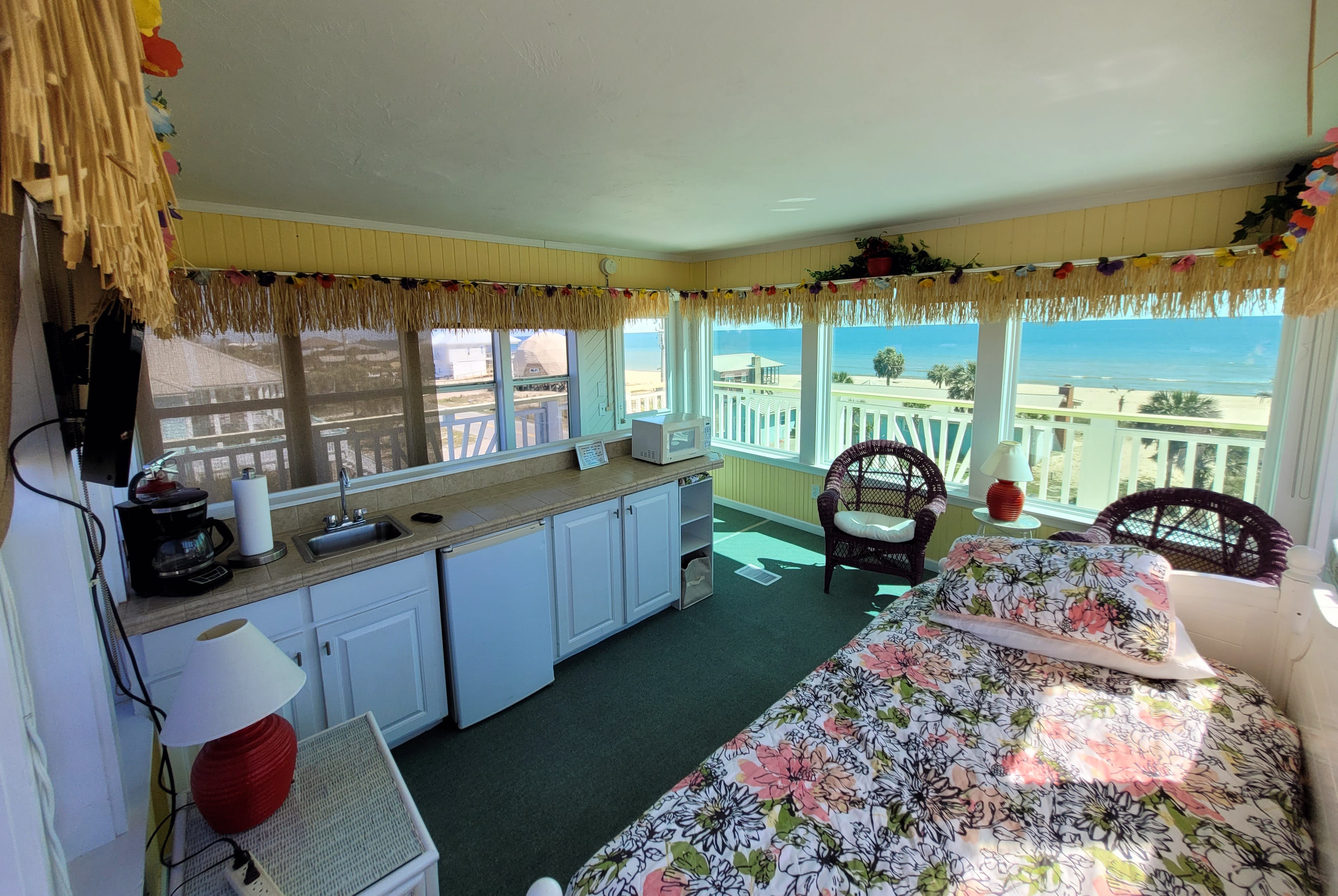 Aloha room with trundle bed, coffee maker, mini fridge, microwave, tv, window ac