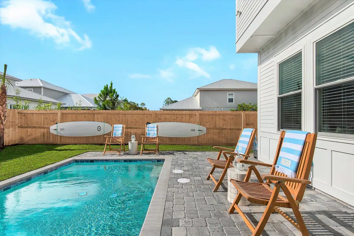 Bliss-3 Don't want to spend your family vacation with strangers at a community pool? We get it. Bliss offers a (seasonally heated) private pool in a fenced back yard complete with paddleboards and propane grill.