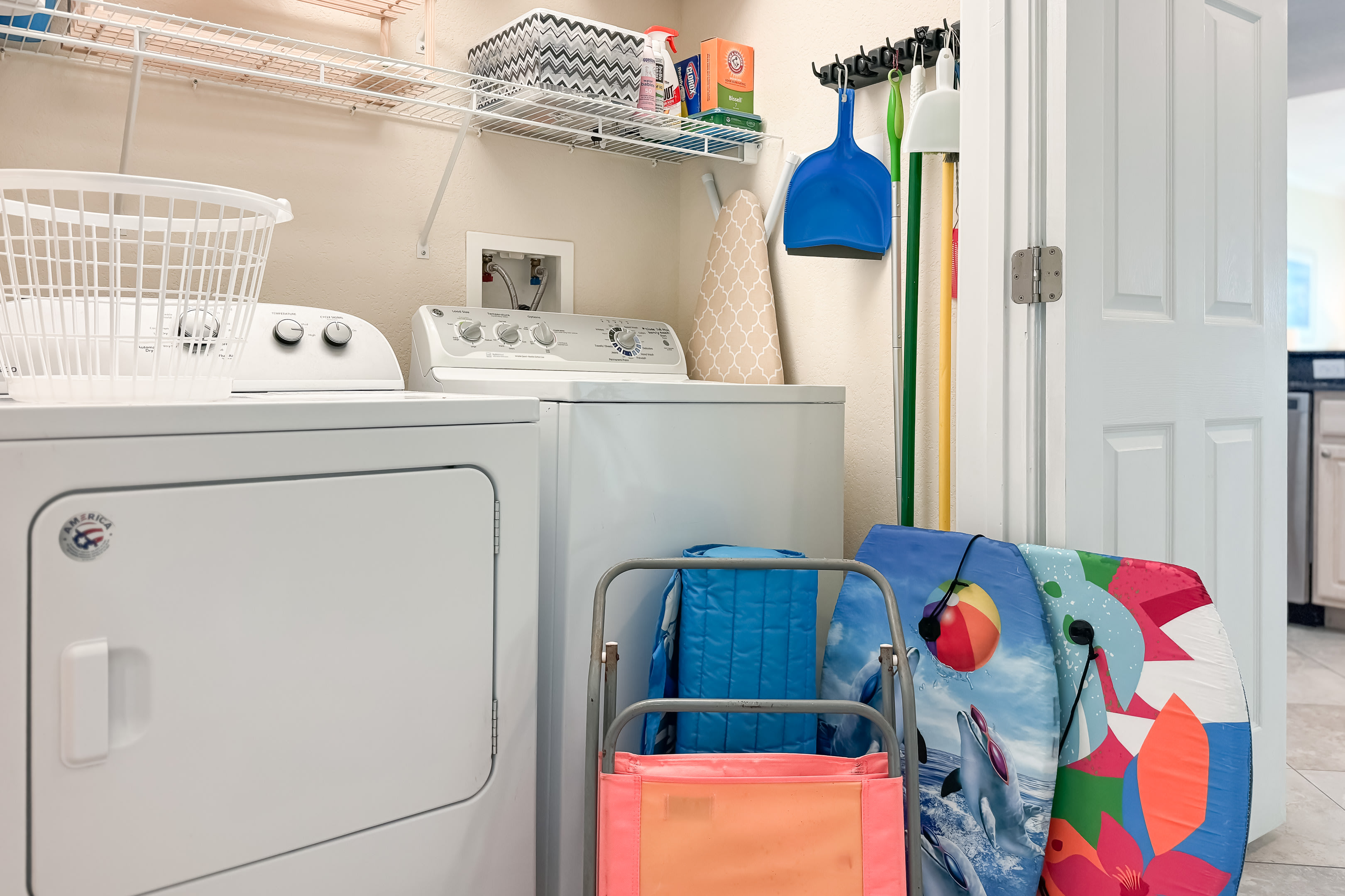 Full sized washer/dryer with a box of things you may need..plus beach supplies