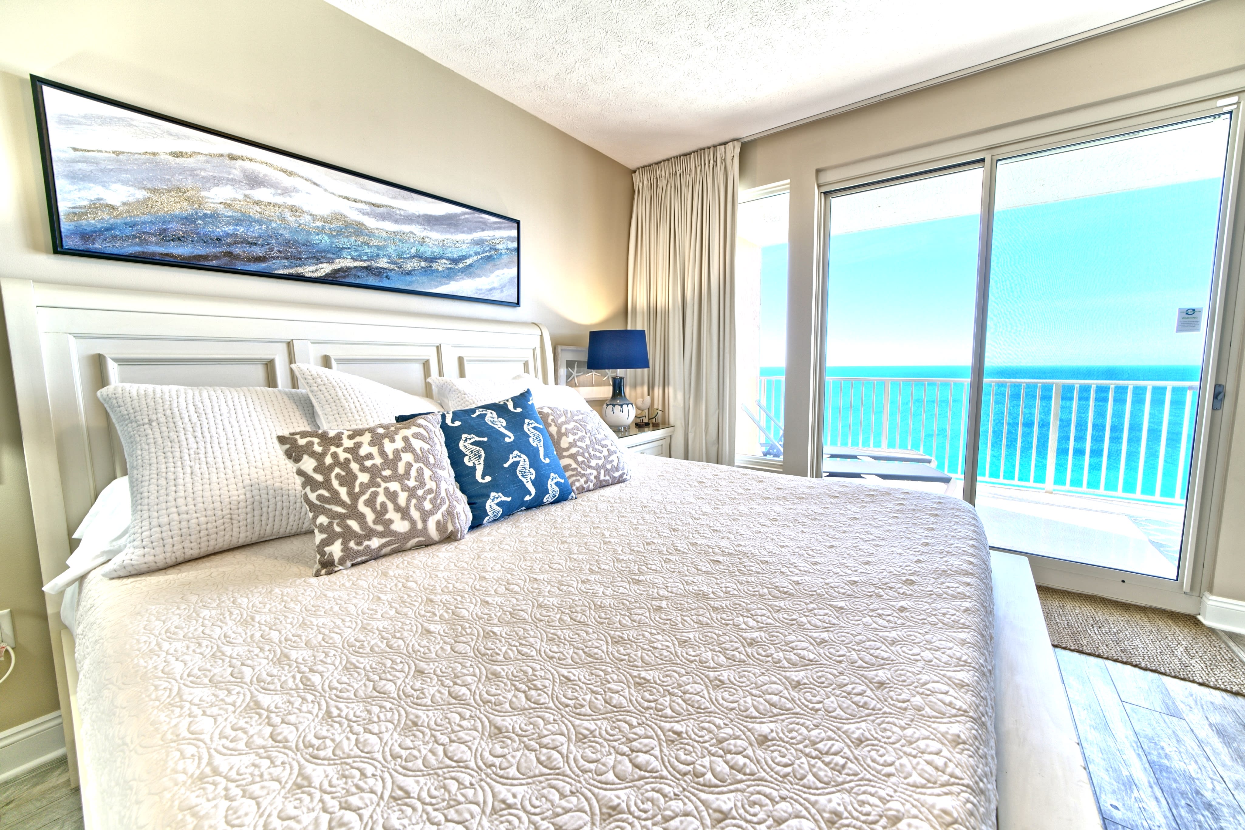 Master bedroom with direct balcony access and beautifyl view of the gulf!