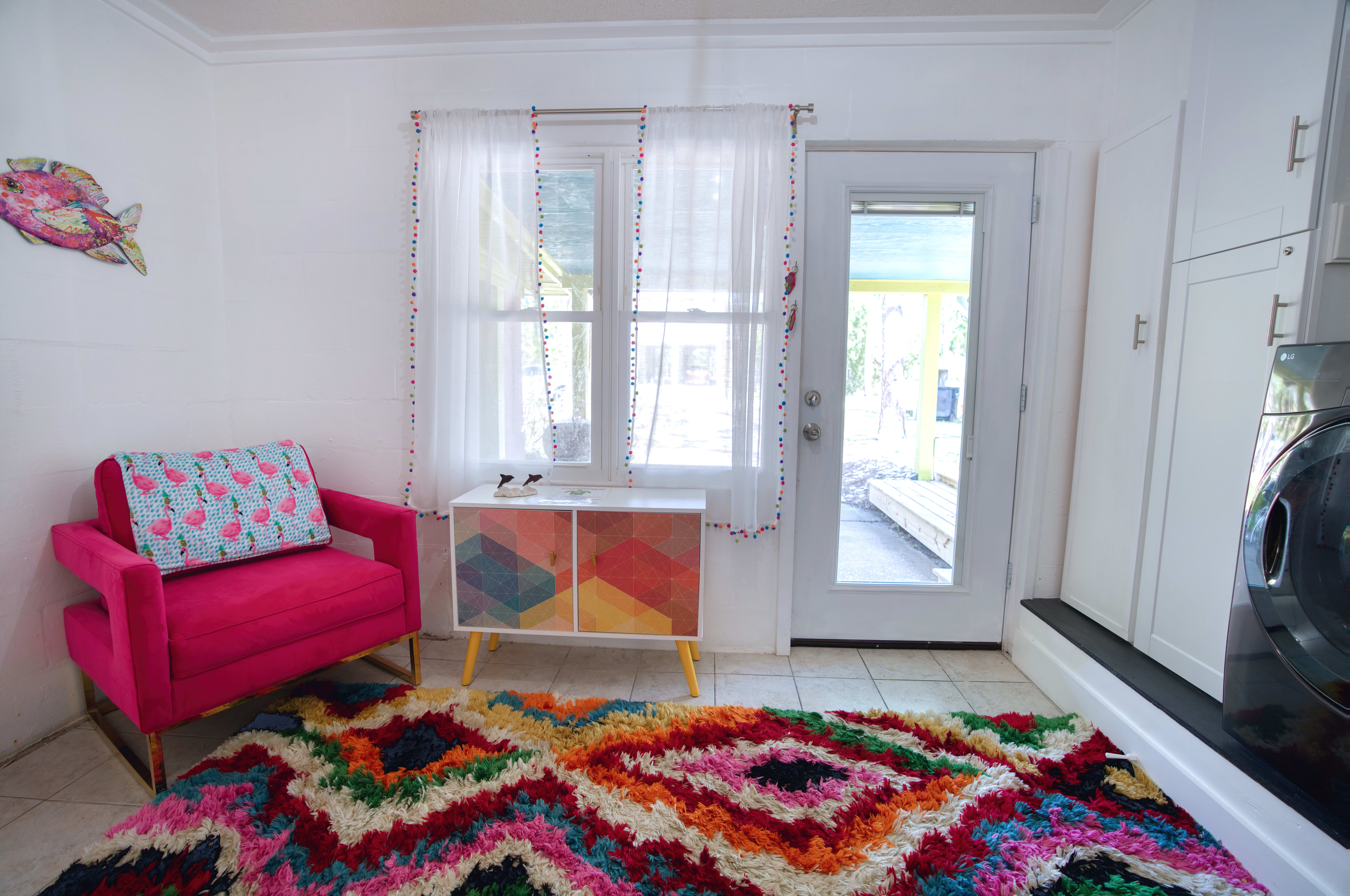 Side entry in to laundry room and seating area. 