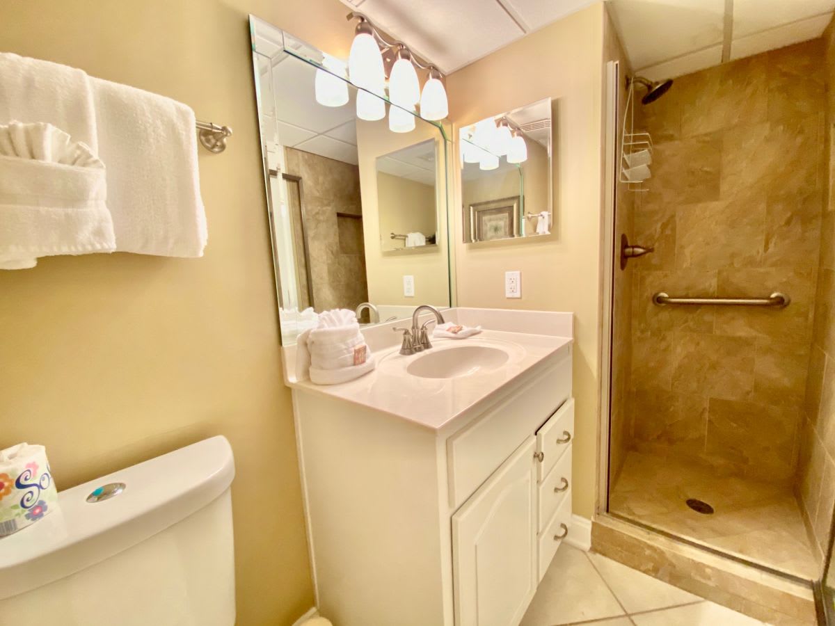 Hall bathroom with tile shower 