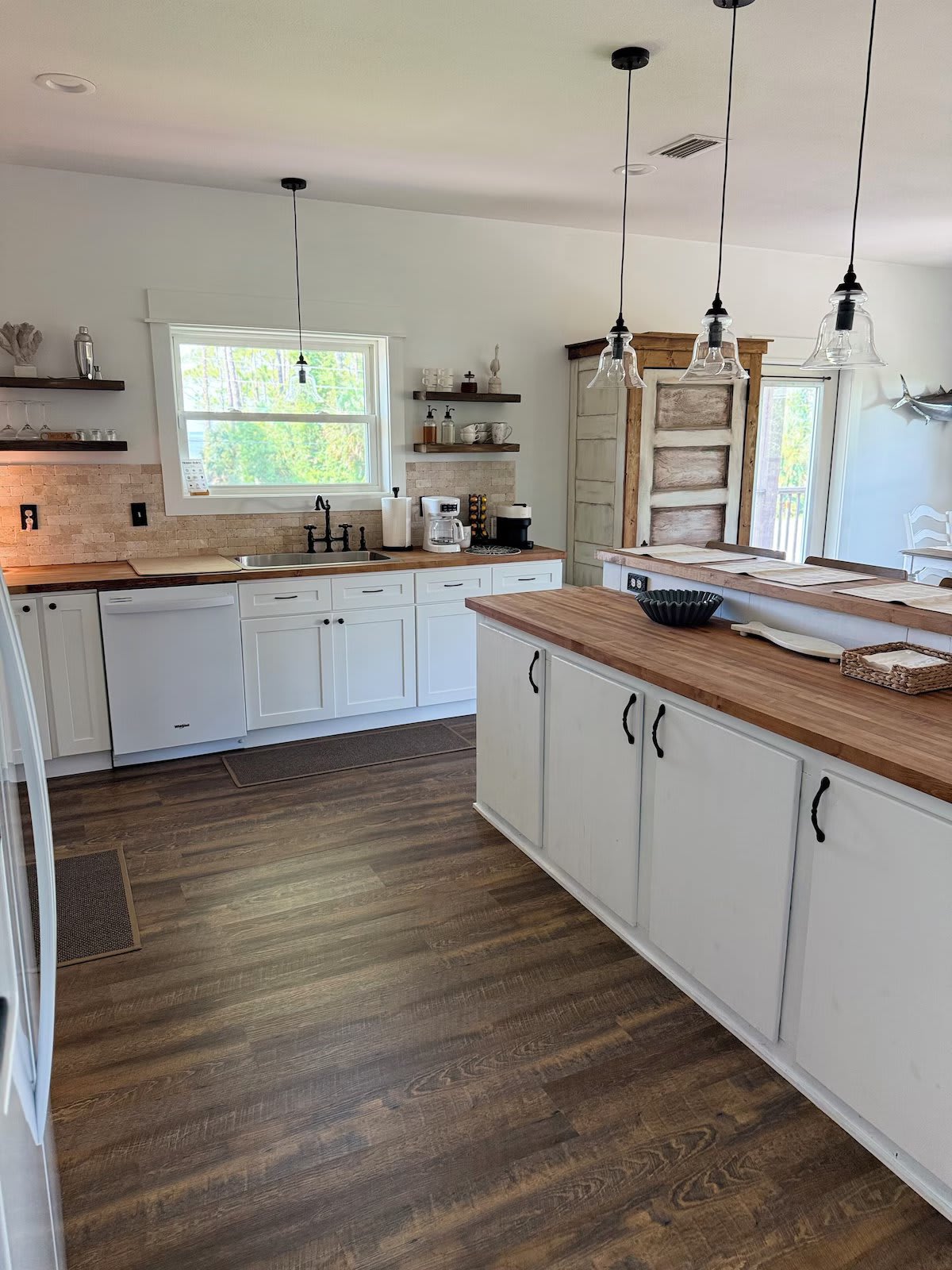 Fully equipped kitchen stocked with cookware, drink ware, silverware, and all other kitchen necessities.