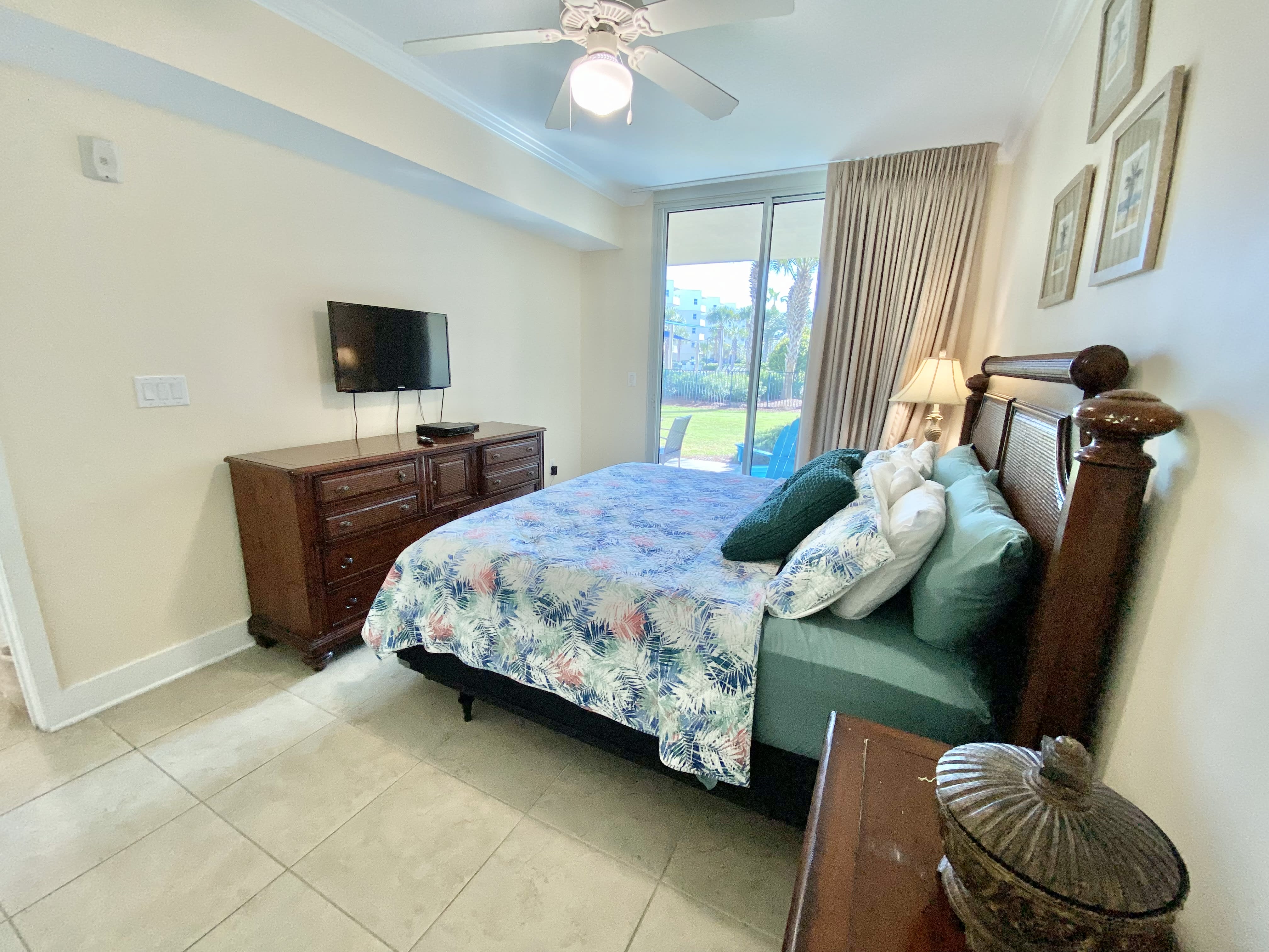 Mater bedroom with king bed and access to the patio.