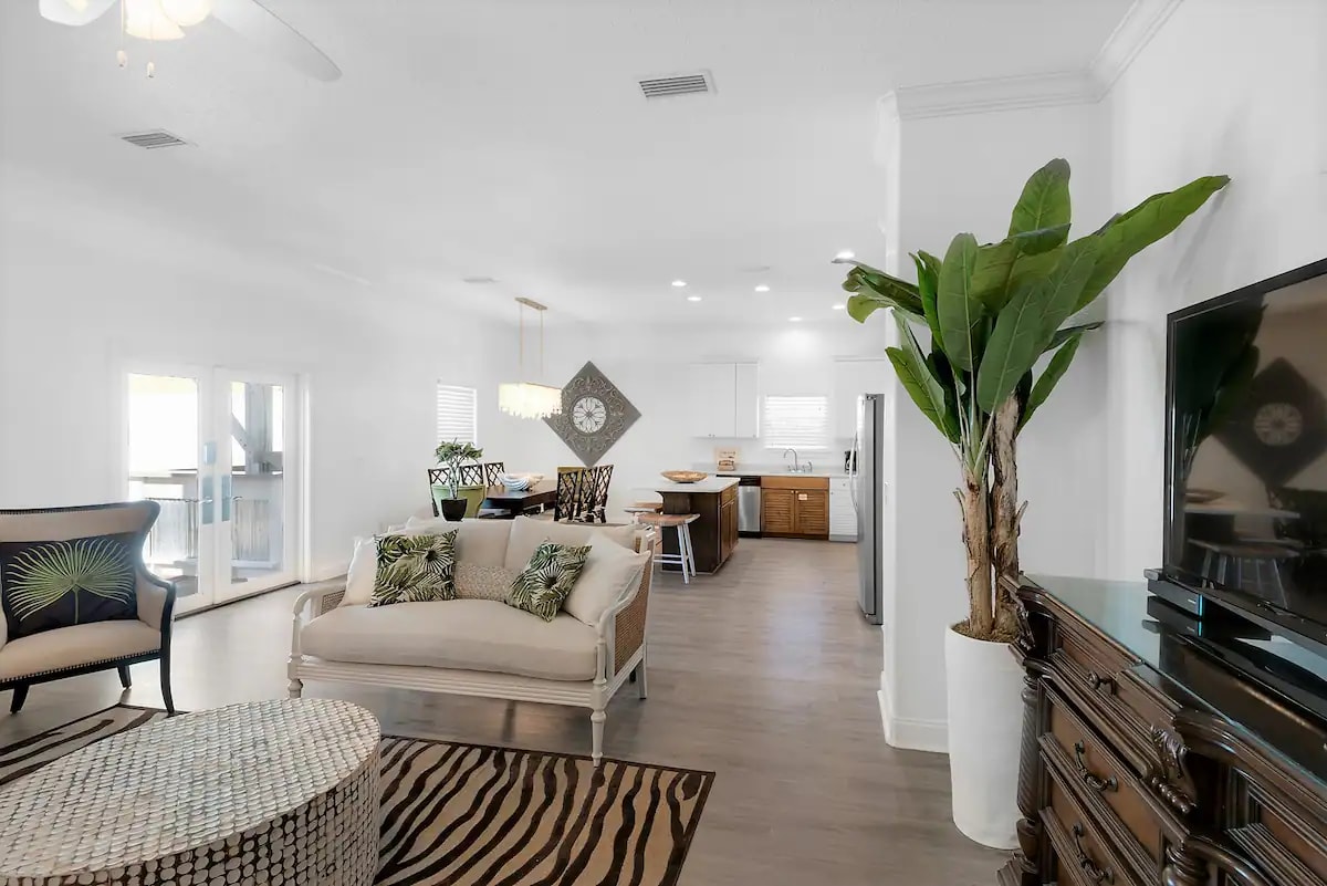 Epic-15 double french doors create an open flow to its huge outdoor seating area.