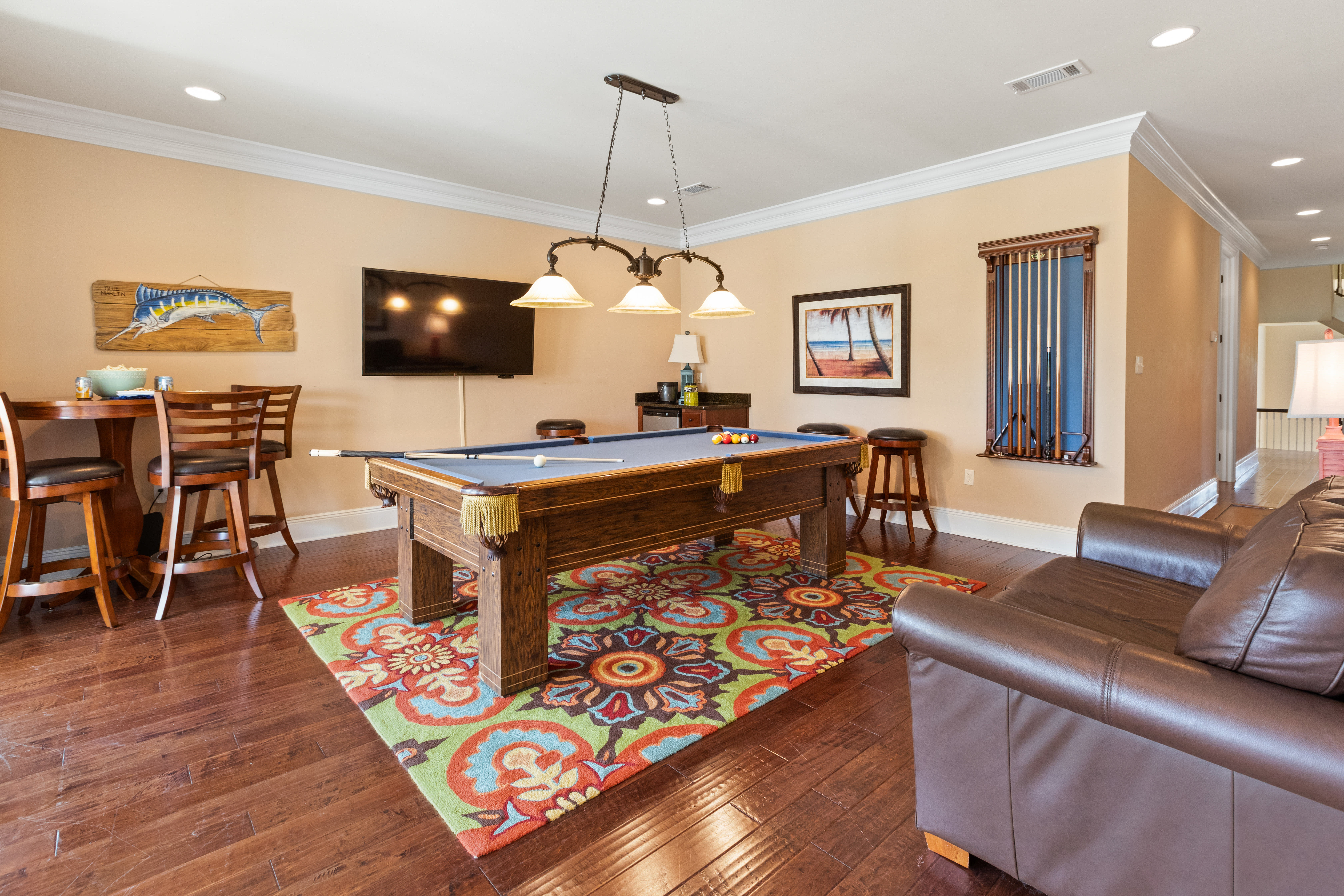 Billiards room with floor to ceiling windows and 2nd floor patio