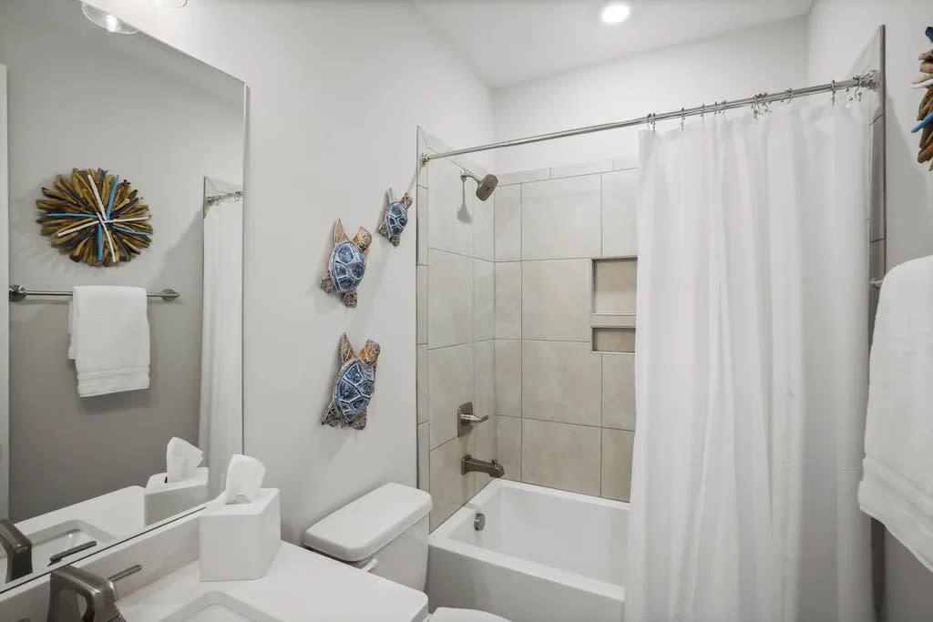 Main Floor Guest Bathroom with Tub and Shower