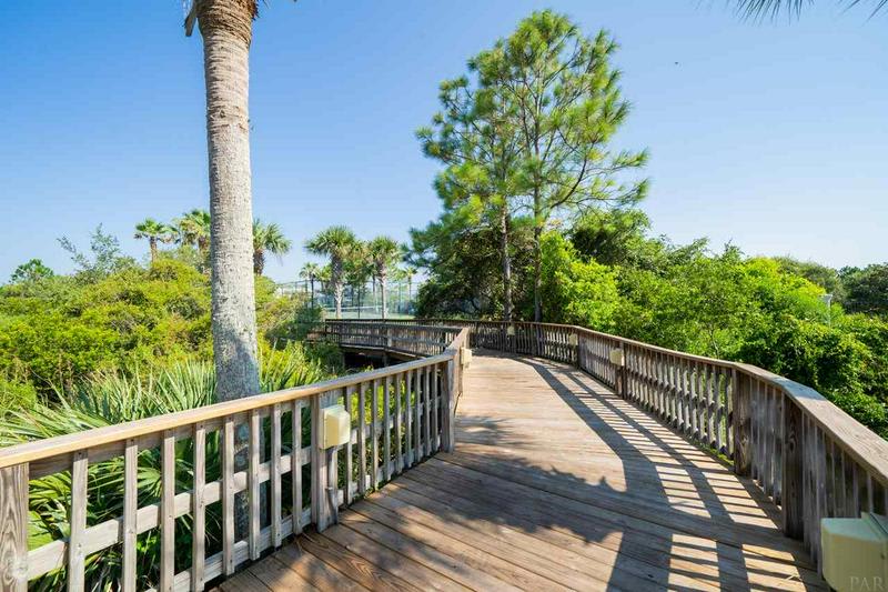Grounds are gorgeous!  Boardwalk leads to pools and tennis.