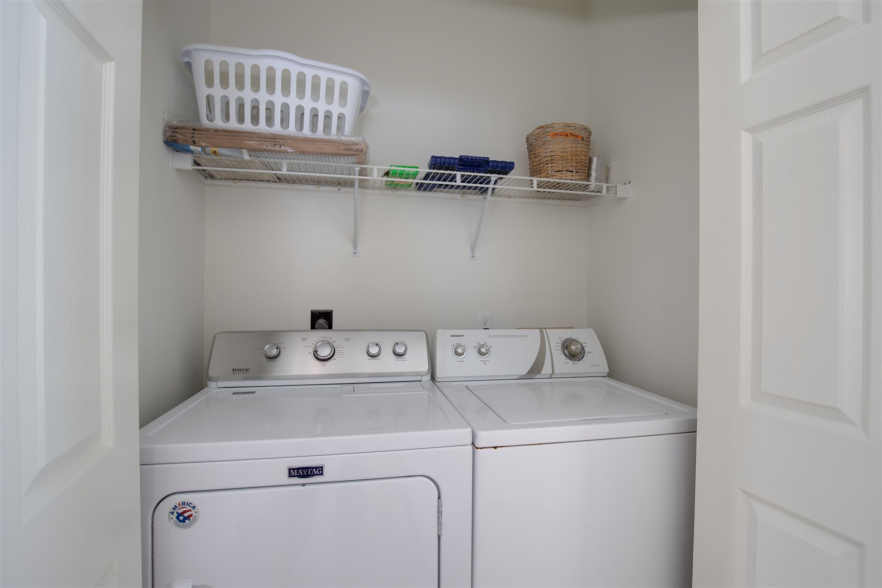 Full size washer and dryer located in the main hall across from downstairs bath.