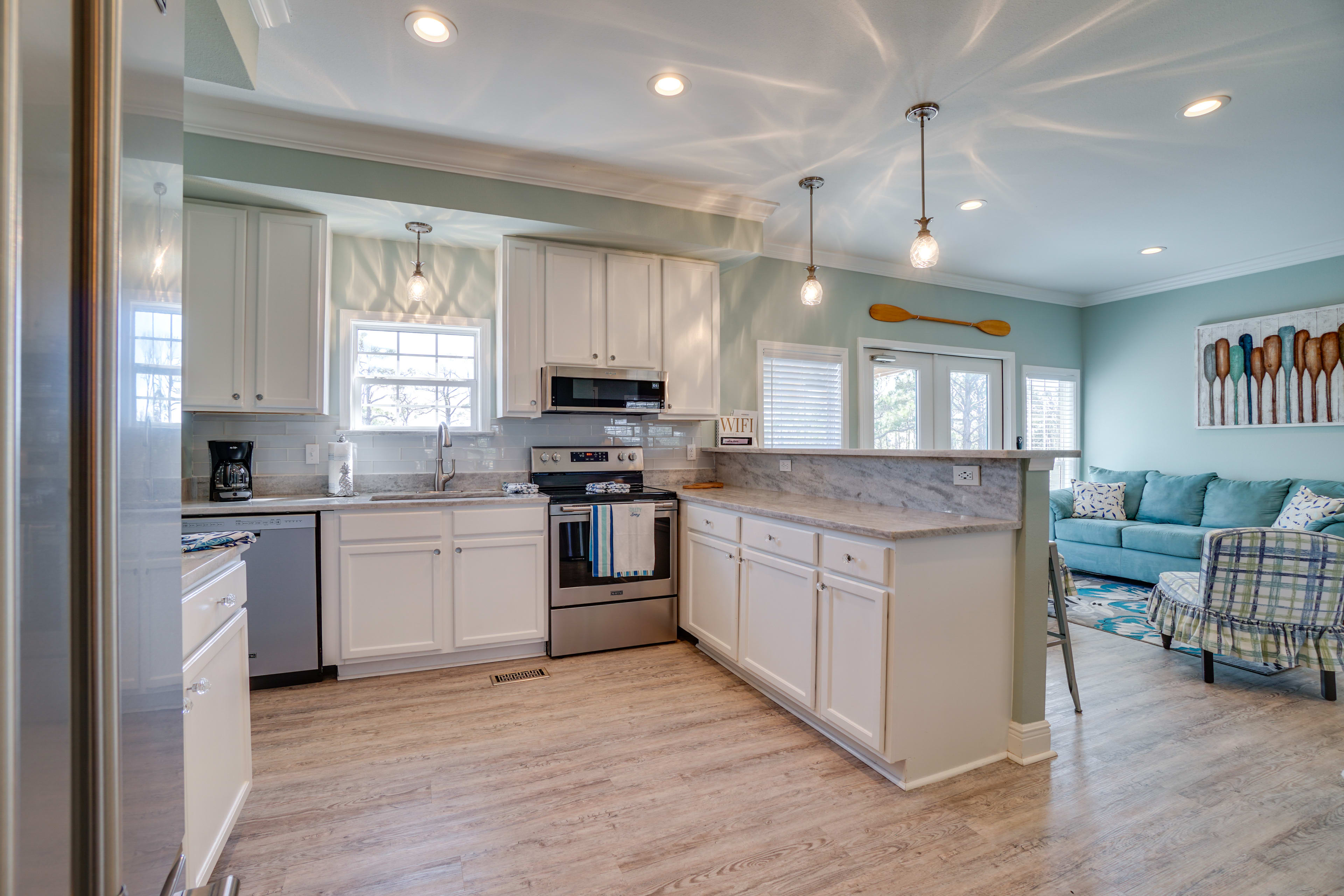 Kitchen with new solid counter tops and all new appliances. Bar seating for 4.