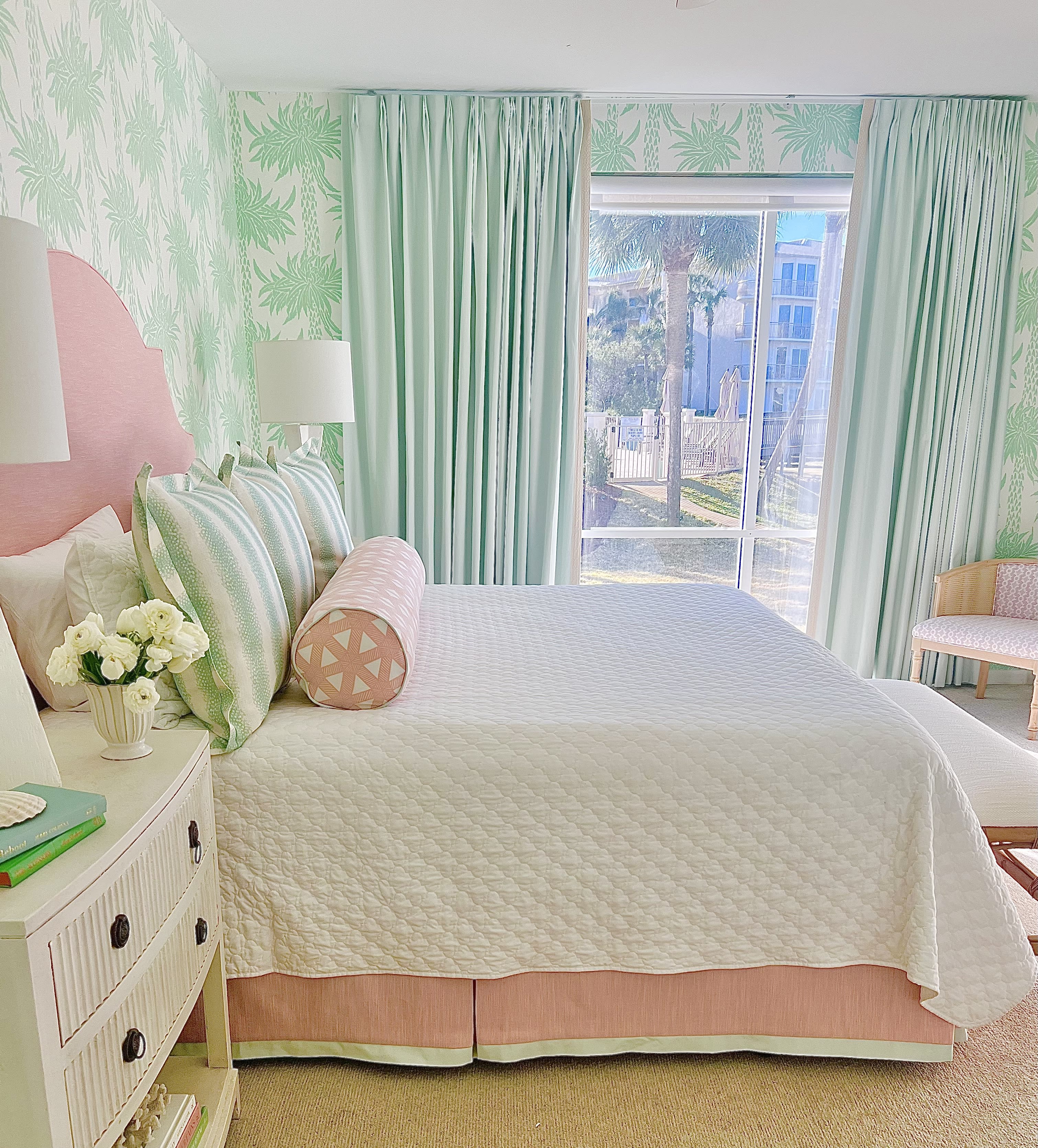 Master bedroom has floor to ceiling windows and door to patio.