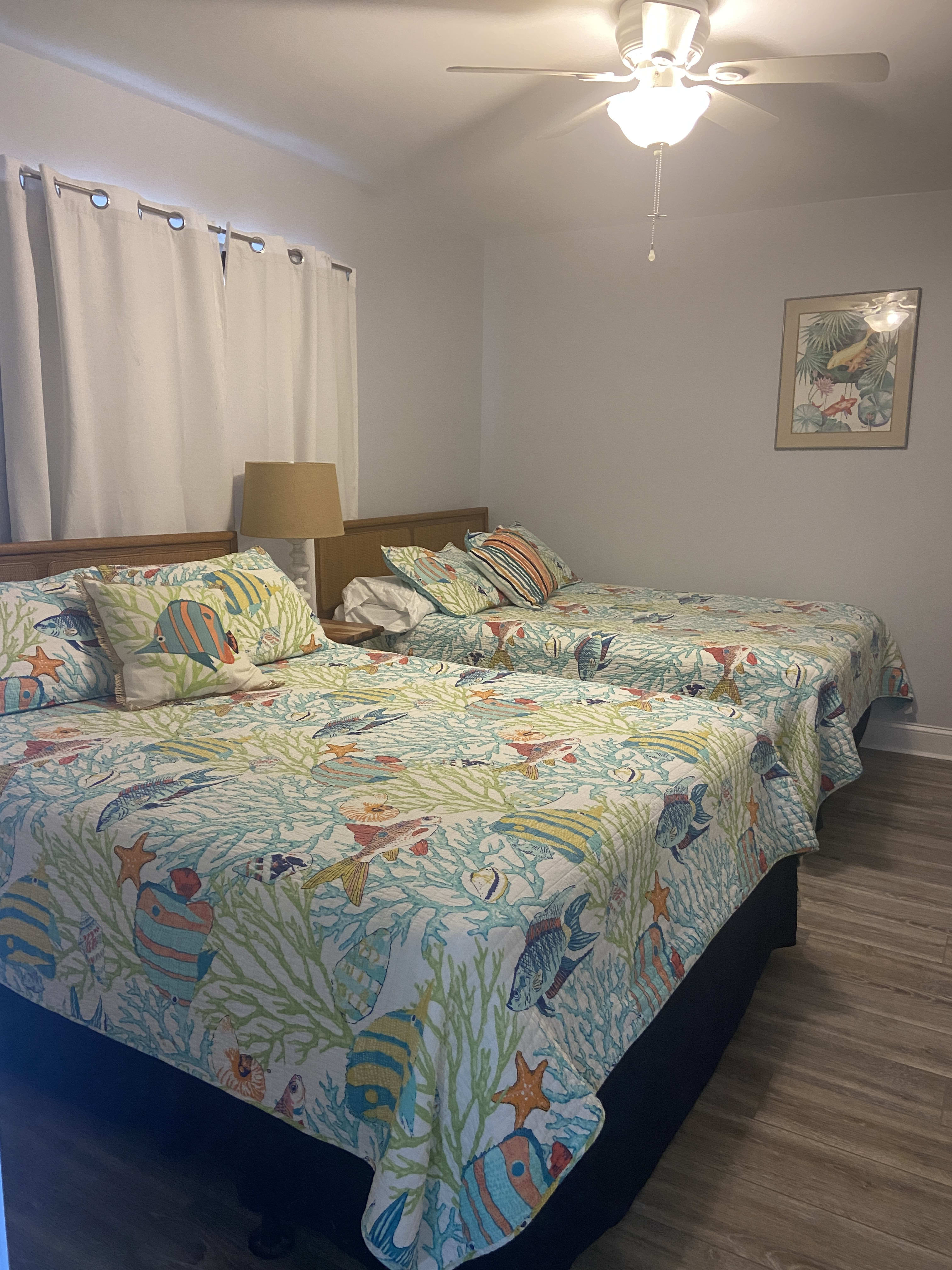 The front bedroom offers two queen beds.