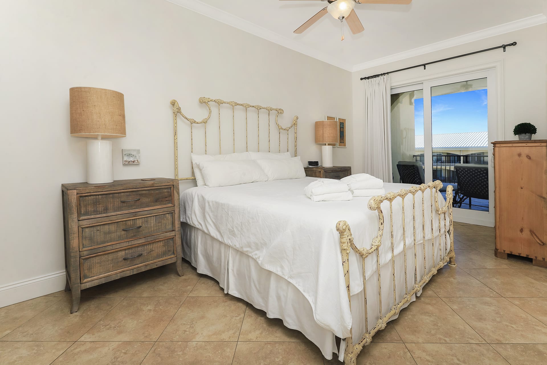 Master BR with king bed sliding glass door to balcony overlooking 3 tiered pool!