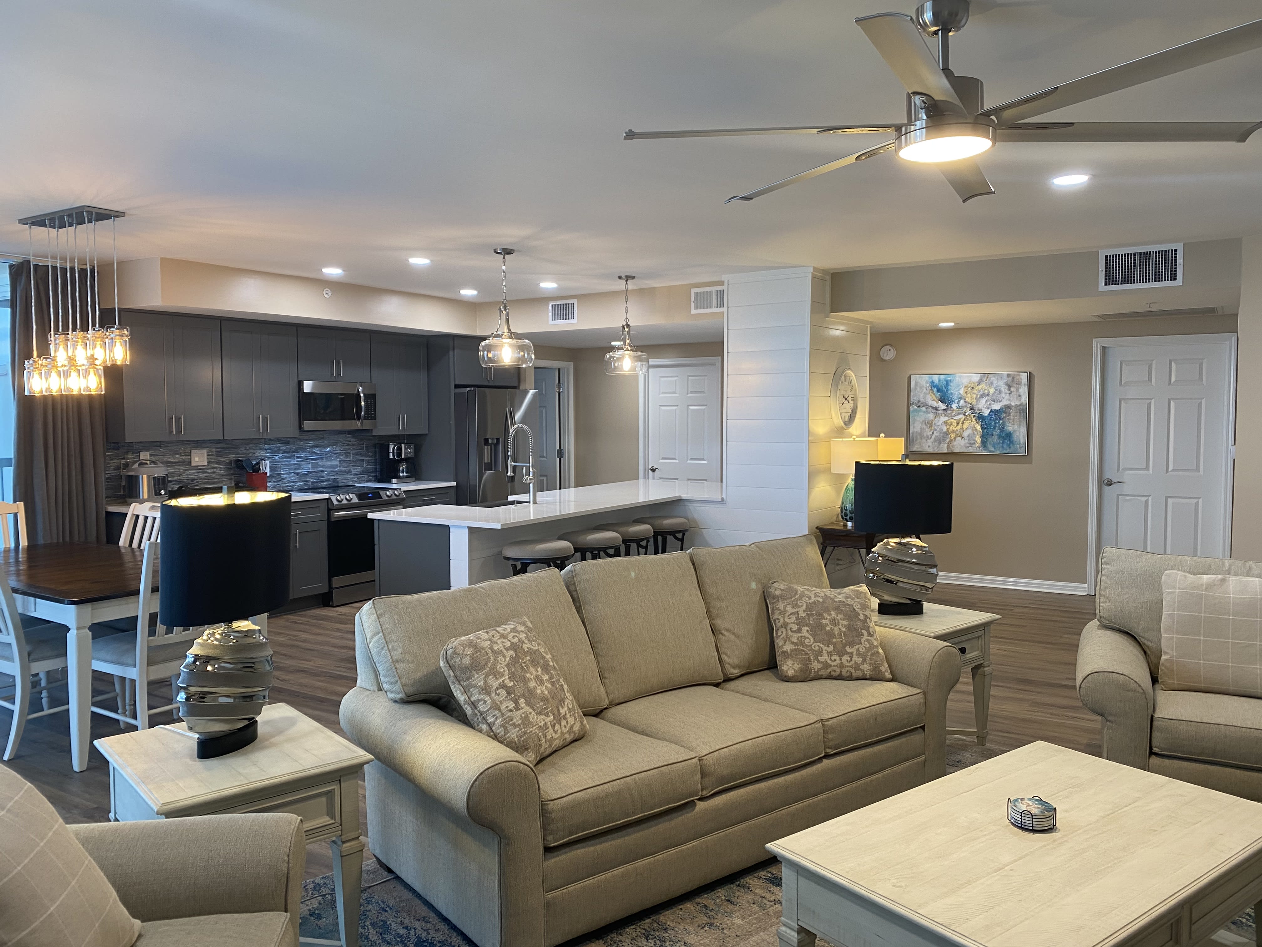 Kincaid Sofa and Chairs in Living area with Ceiling Fan and overhead Lights